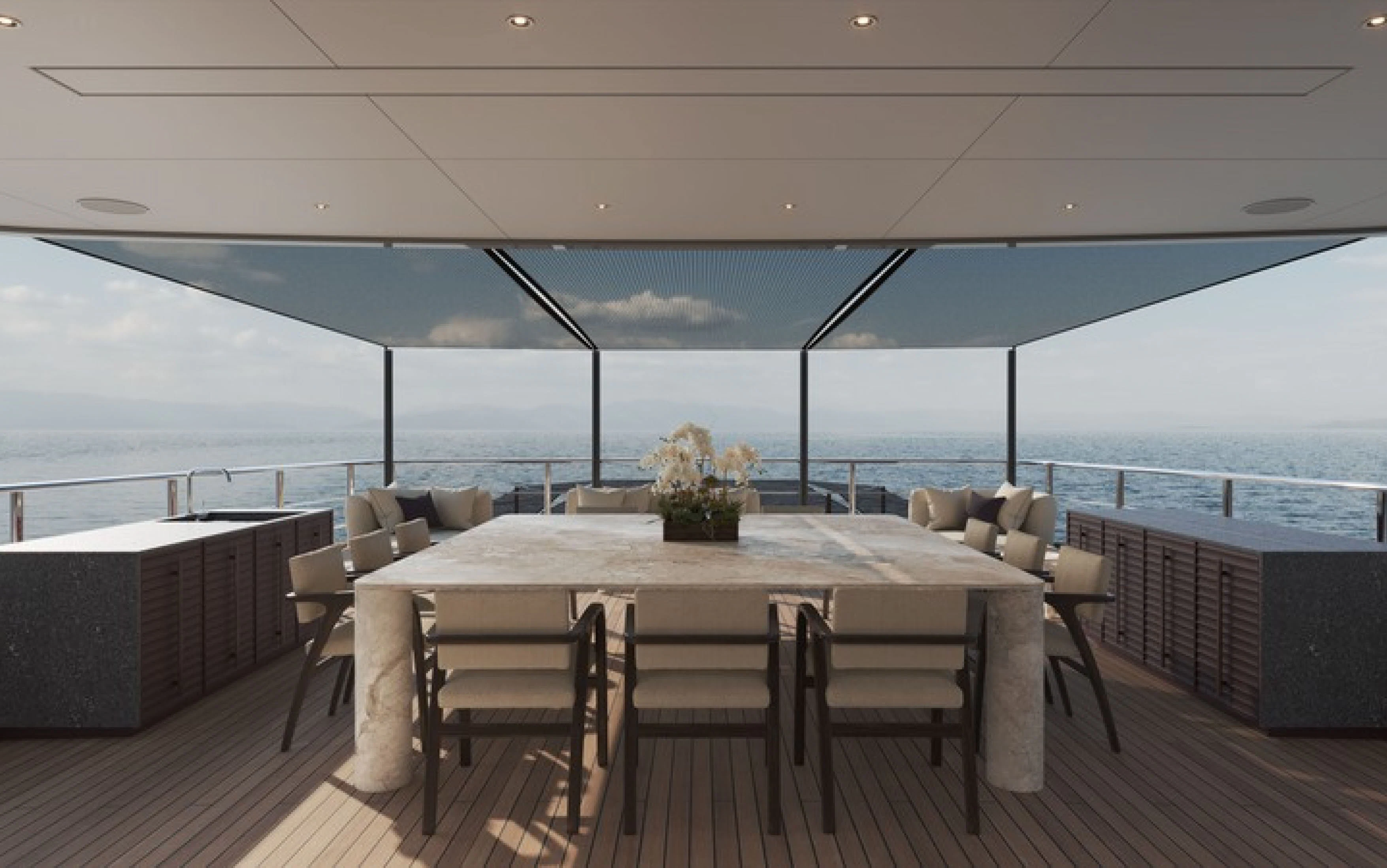 a table and chairs on a deck aboard CASA F Yacht for Charter