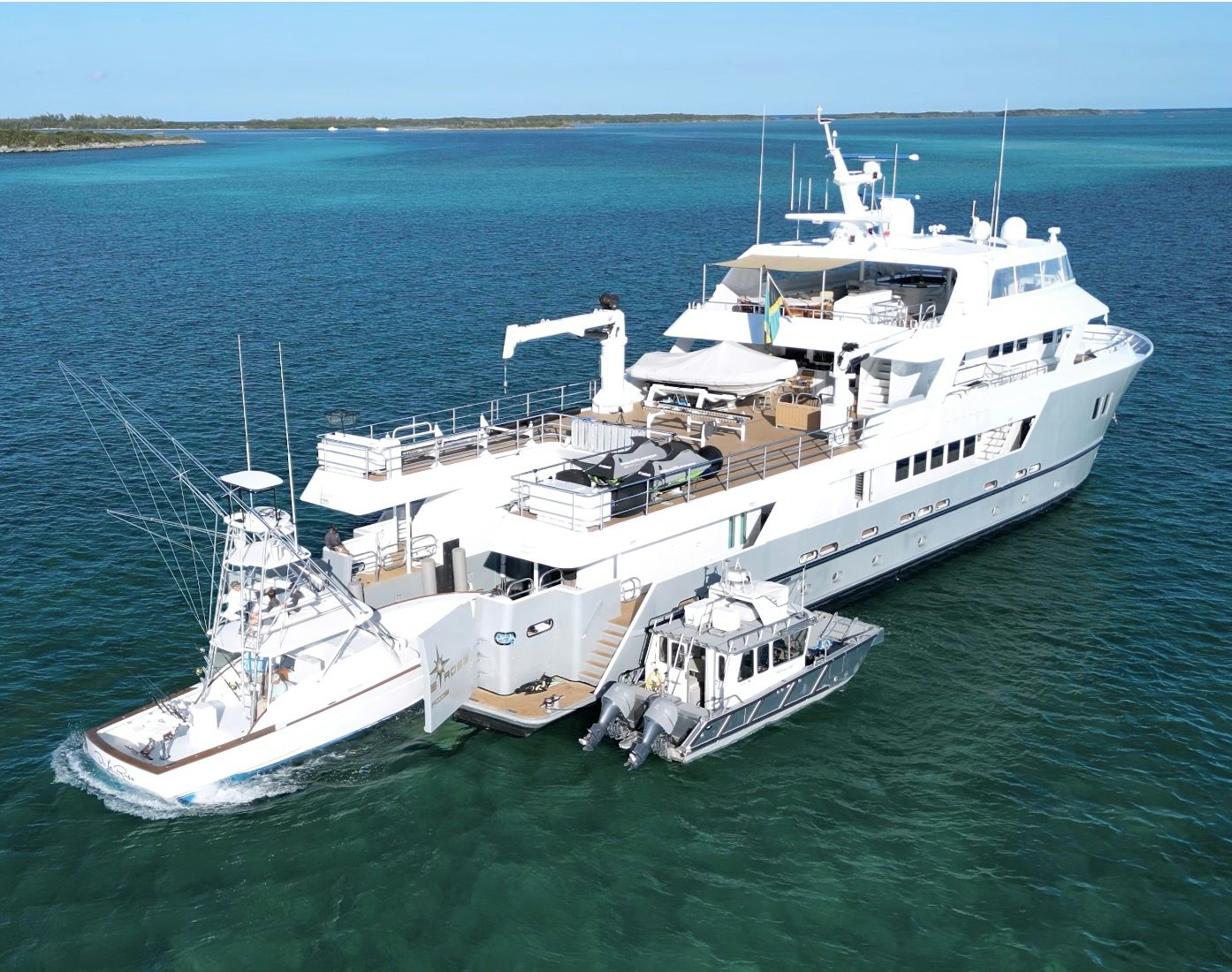 a large white boat with a drone on it aboard COMPASS ROSE Yacht for Sale