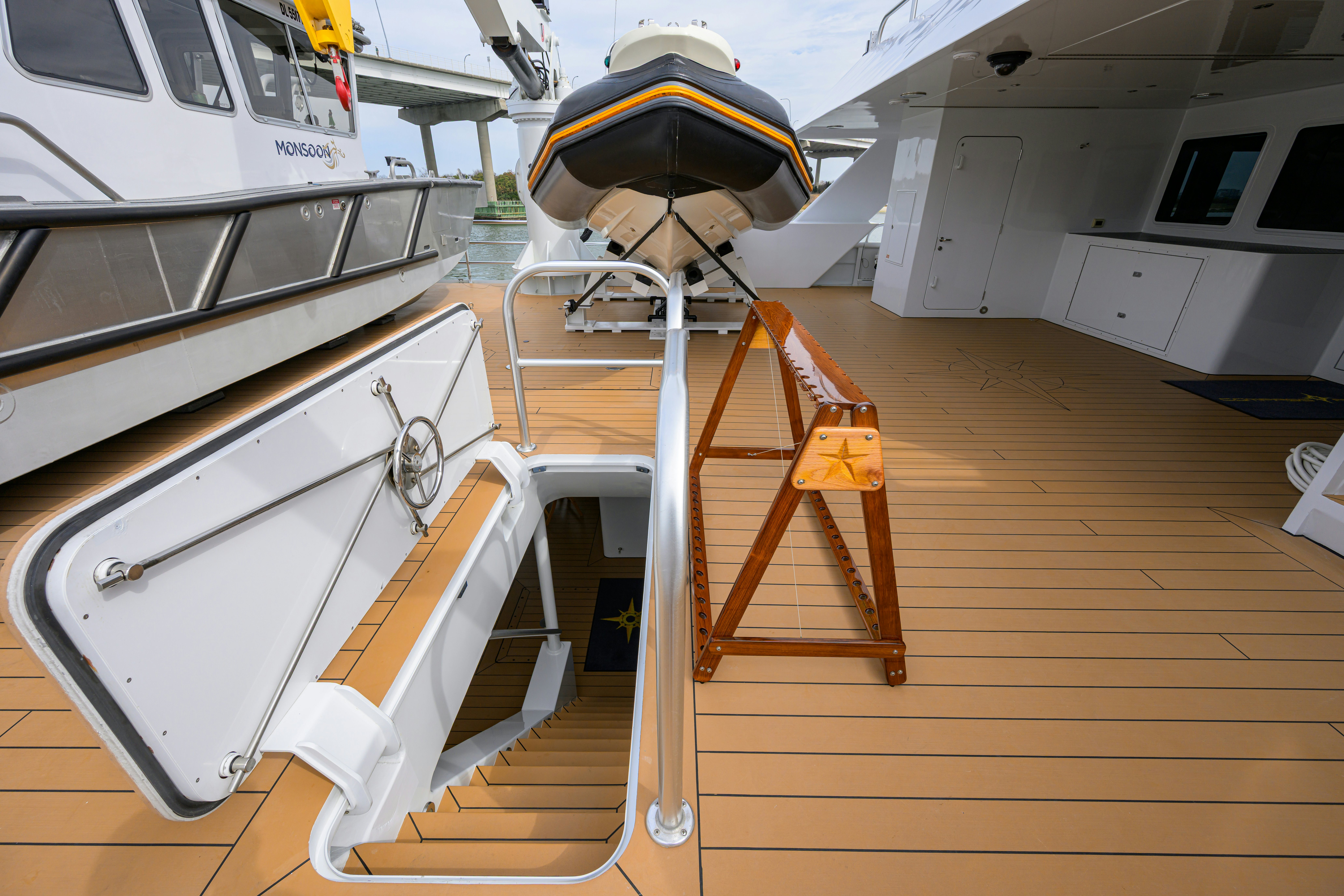 a boat with a ladder on the deck aboard COMPASS ROSE Yacht for Sale