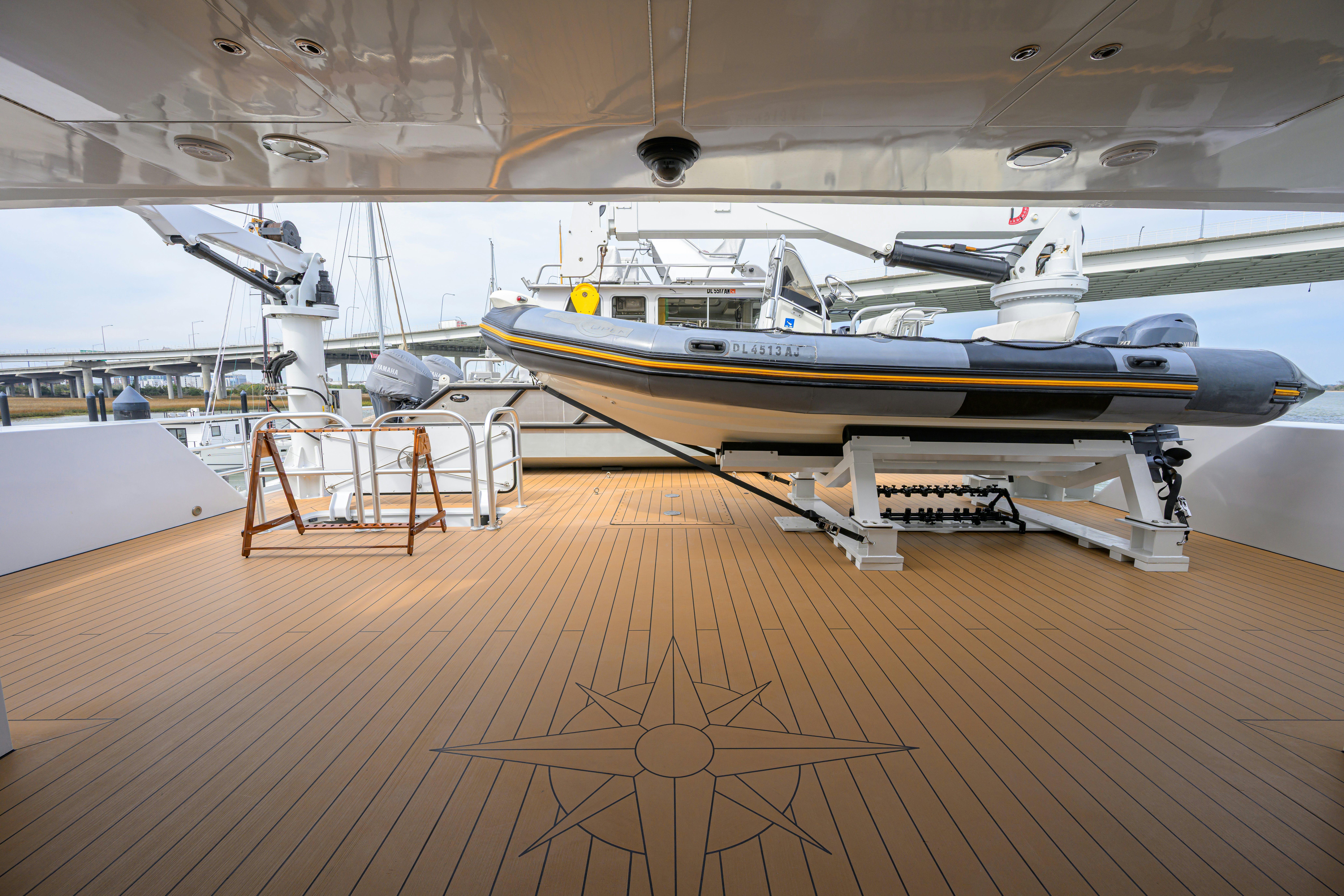 a model of a space shuttle on a wooden platform aboard COMPASS ROSE Yacht for Sale
