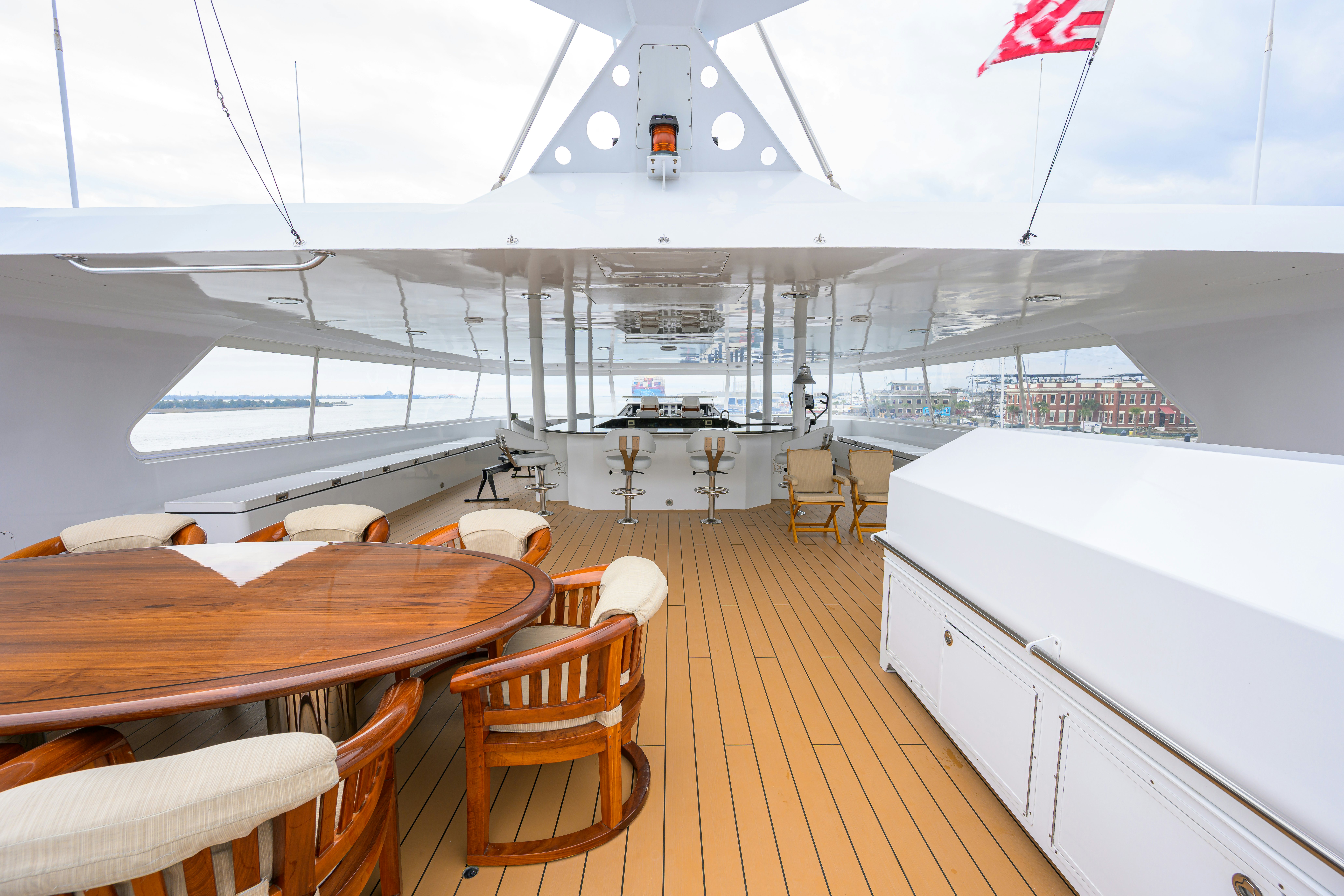 a large ship with tables and chairs aboard COMPASS ROSE Yacht for Sale