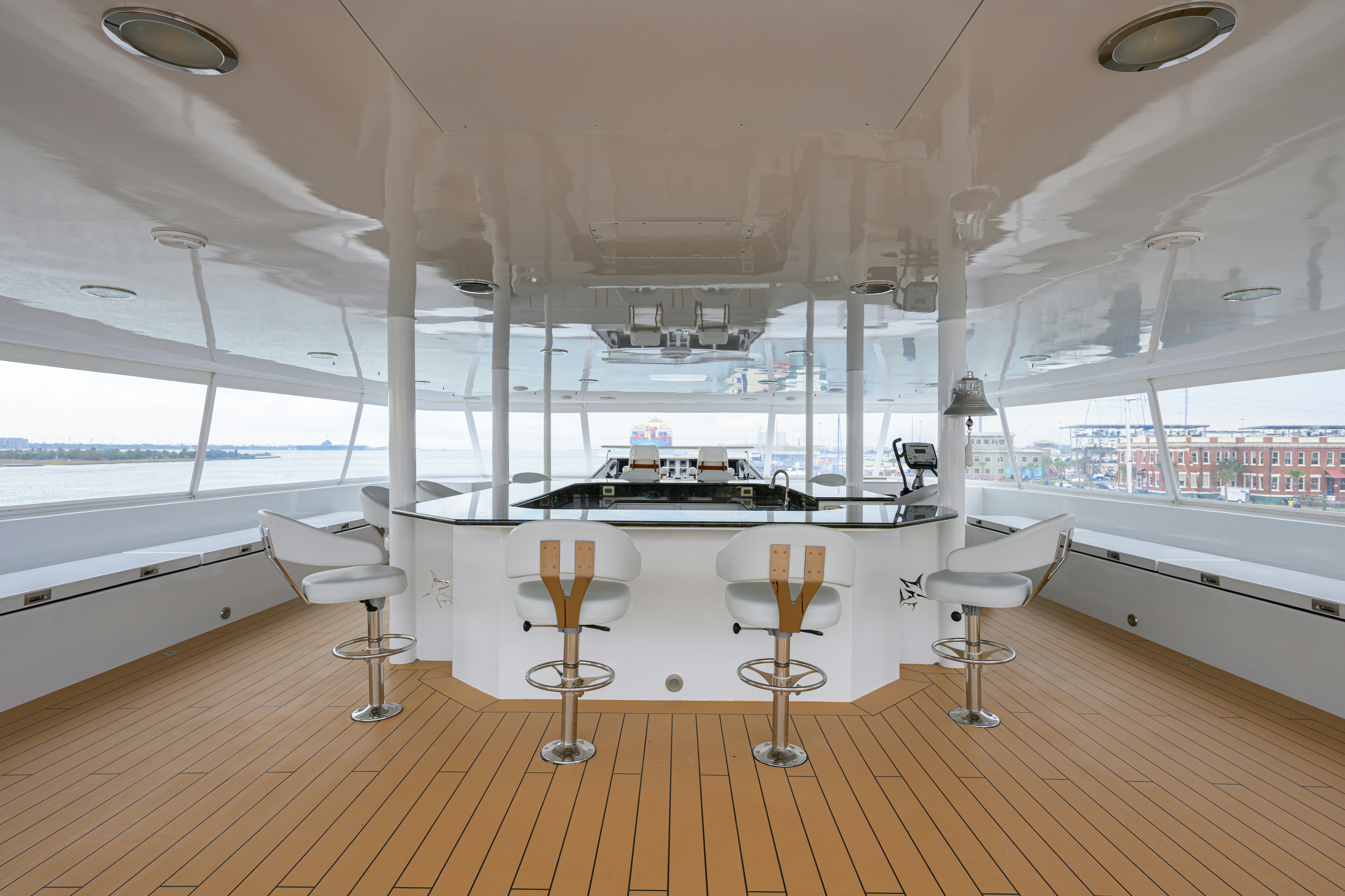 a room with a table and chairs aboard COMPASS ROSE Yacht for Sale