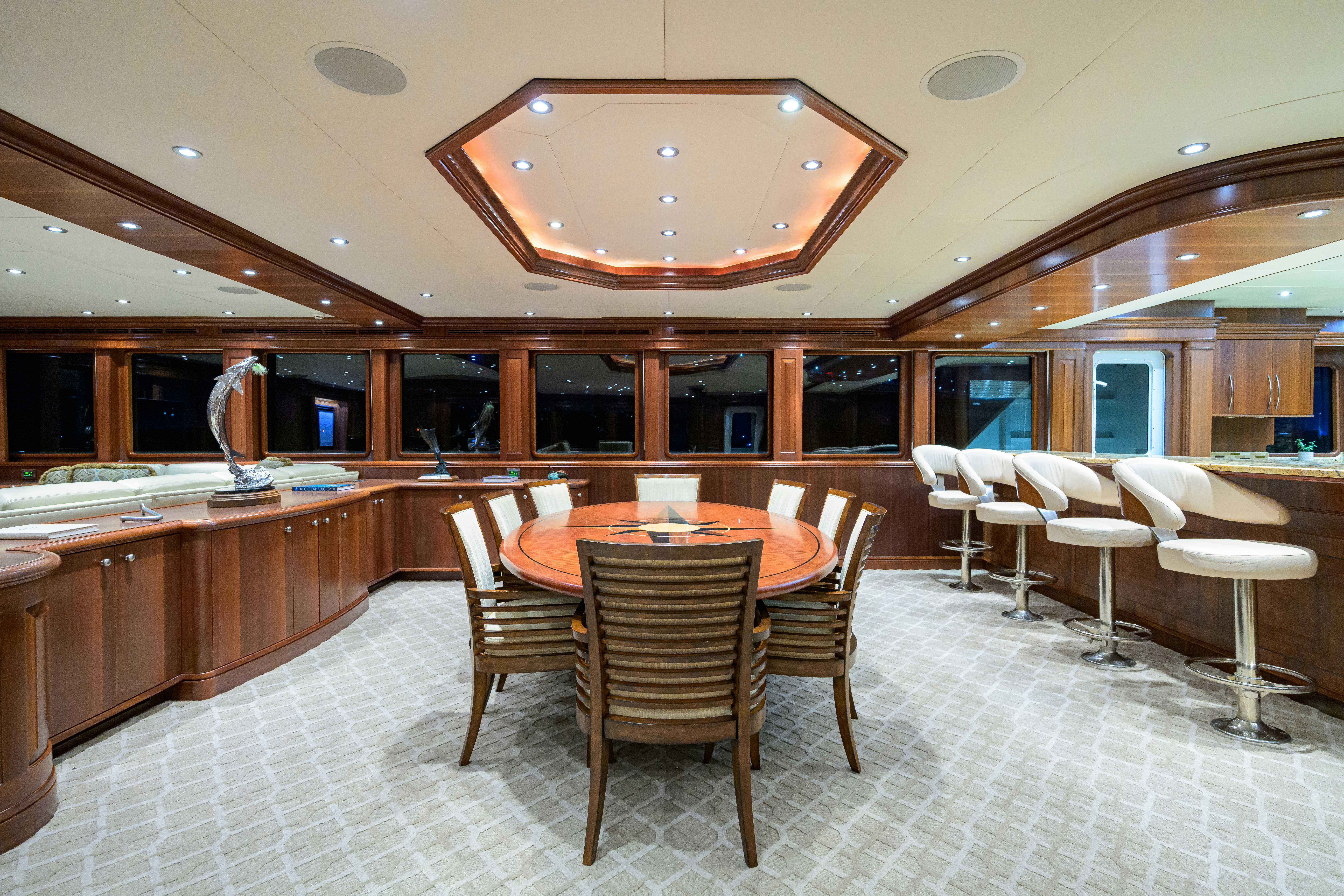 a large kitchen with a table and chairs aboard COMPASS ROSE Yacht for Sale