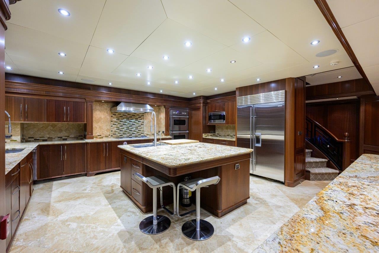 a kitchen with a bar and a bar aboard COMPASS ROSE Yacht for Sale