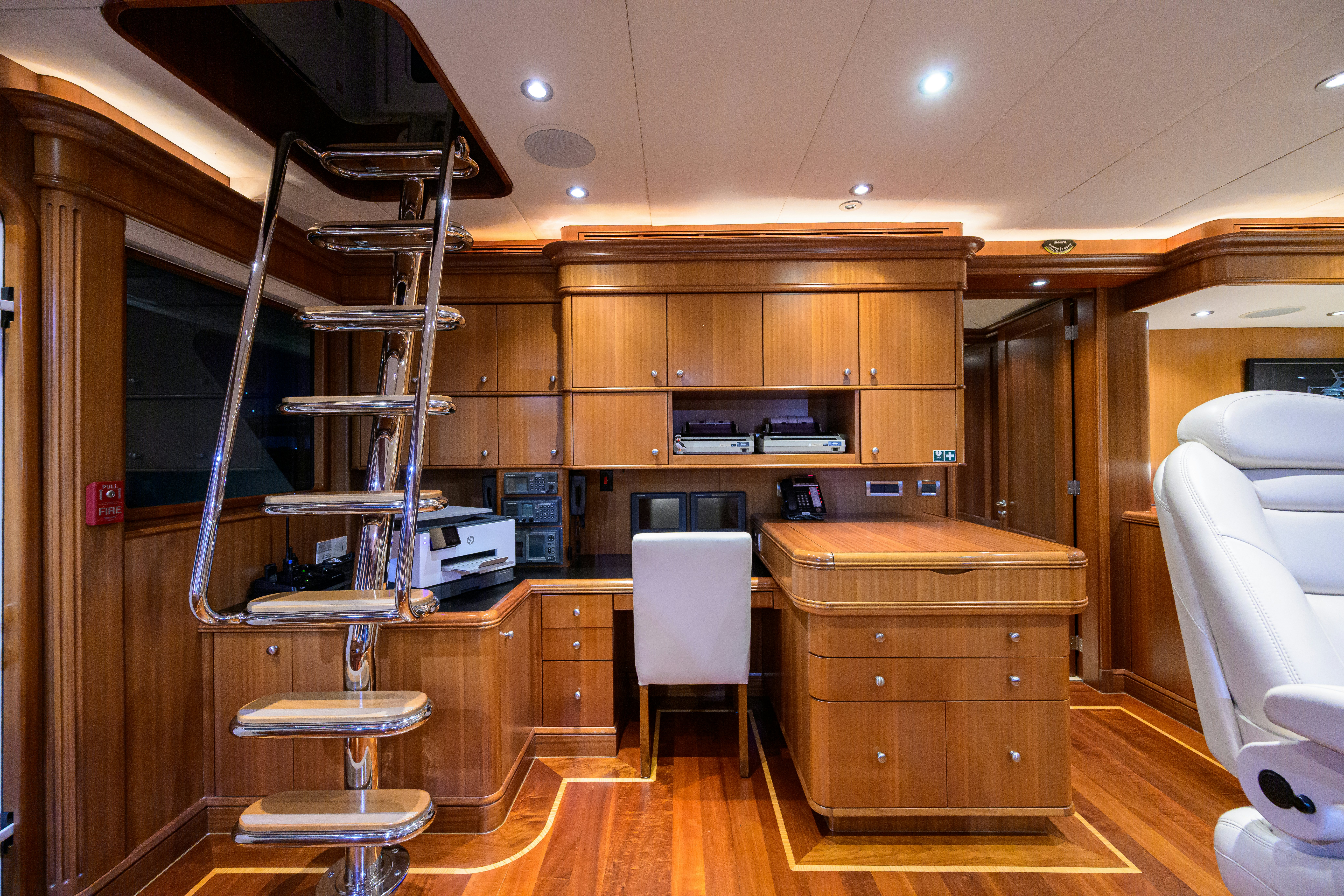 a room with a bunk bed and desk aboard COMPASS ROSE Yacht for Sale