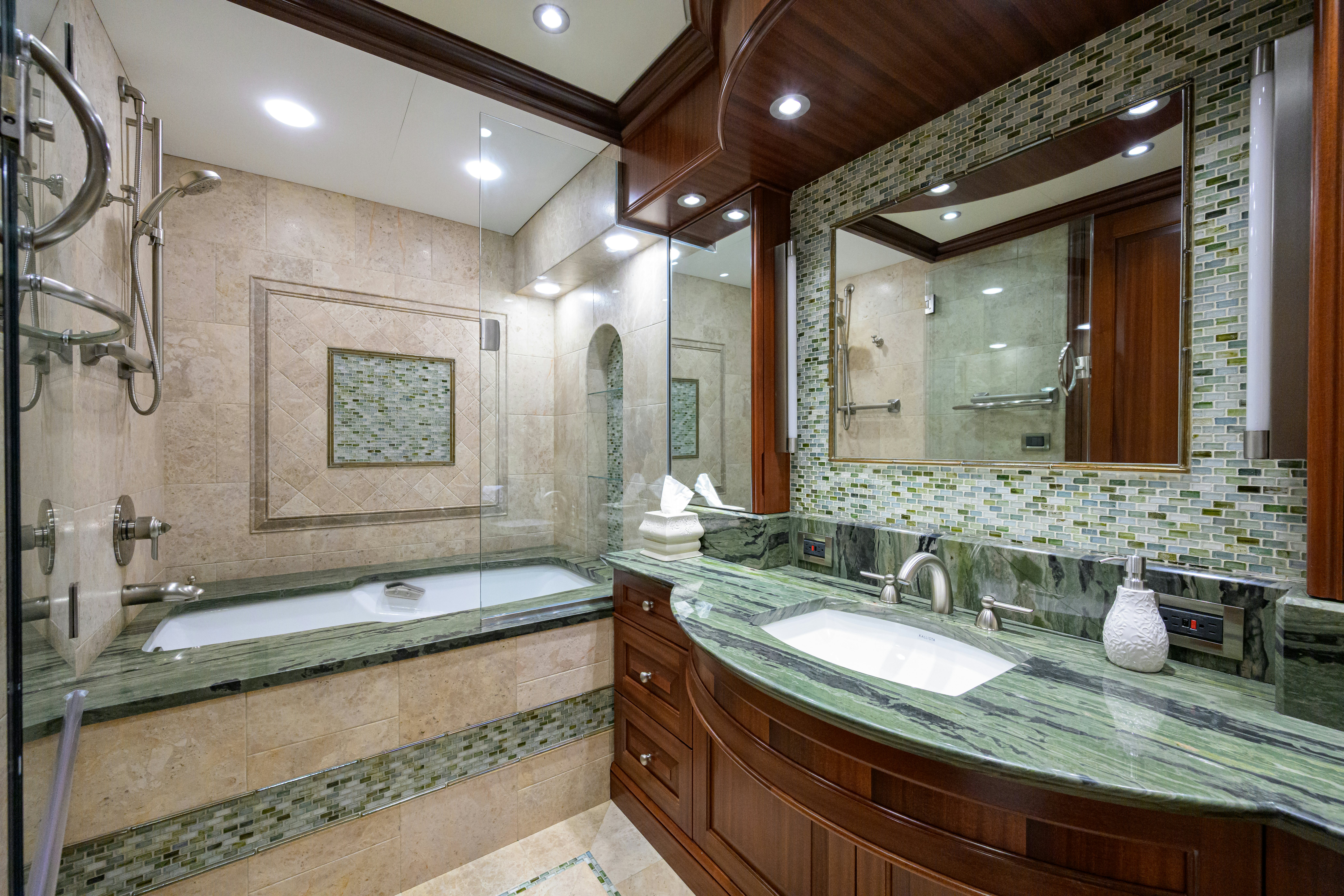 a bathroom with a large mirror aboard COMPASS ROSE Yacht for Sale