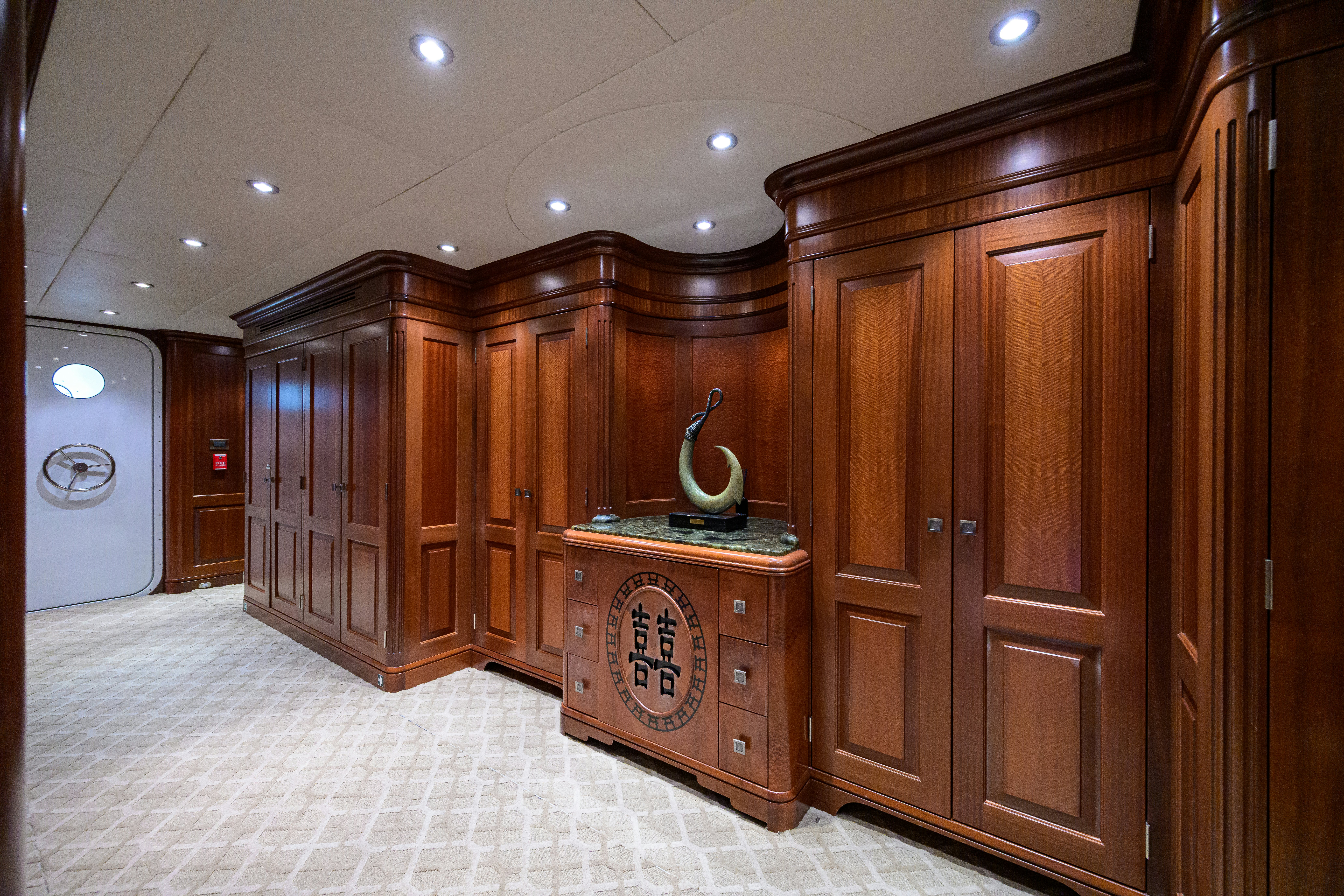 a room with wooden cabinets aboard COMPASS ROSE Yacht for Sale