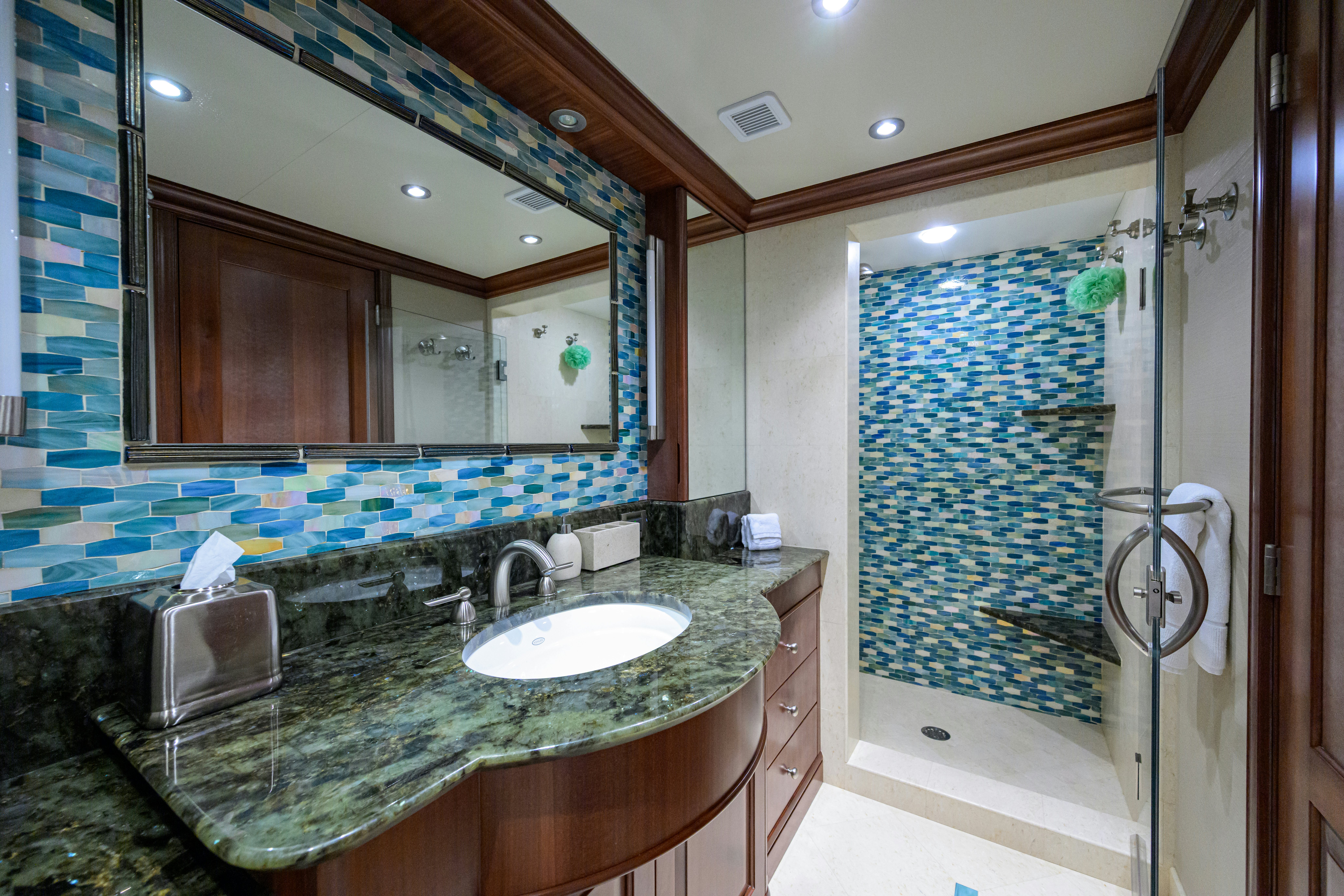 a bathroom with a marble counter top aboard COMPASS ROSE Yacht for Sale
