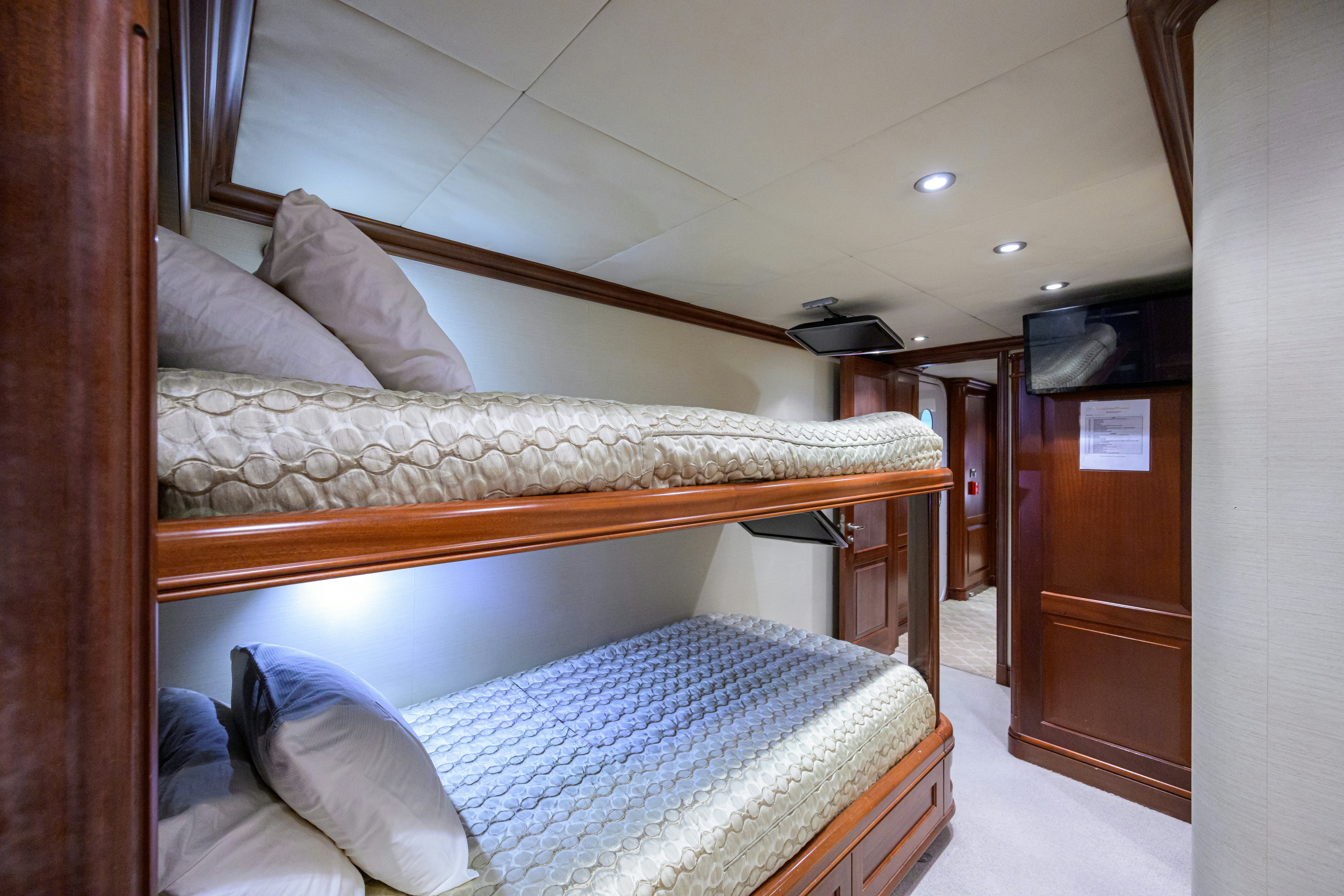 a bed with a white sheet aboard COMPASS ROSE Yacht for Sale