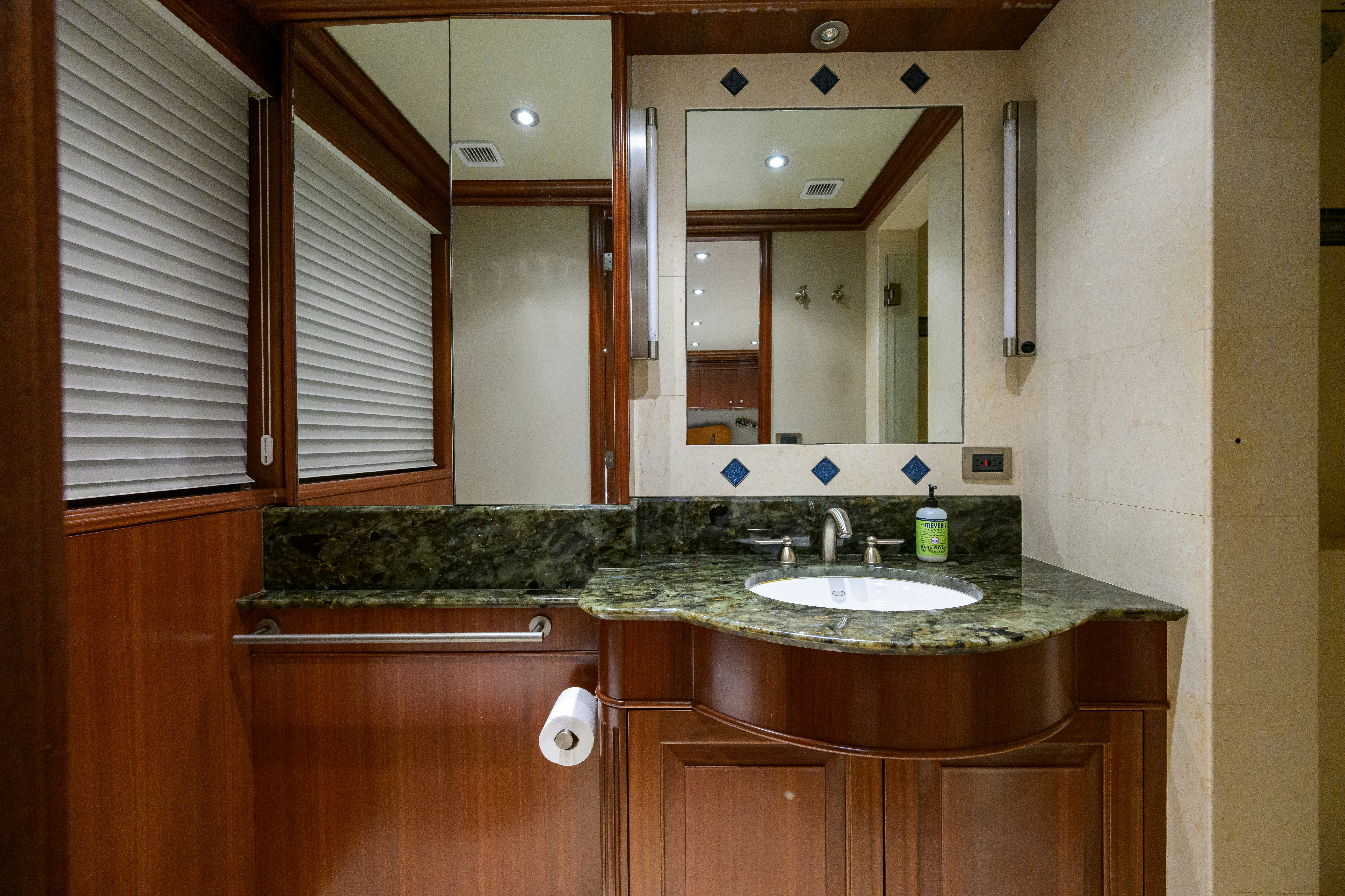 a bathroom with a marble counter top aboard COMPASS ROSE Yacht for Sale