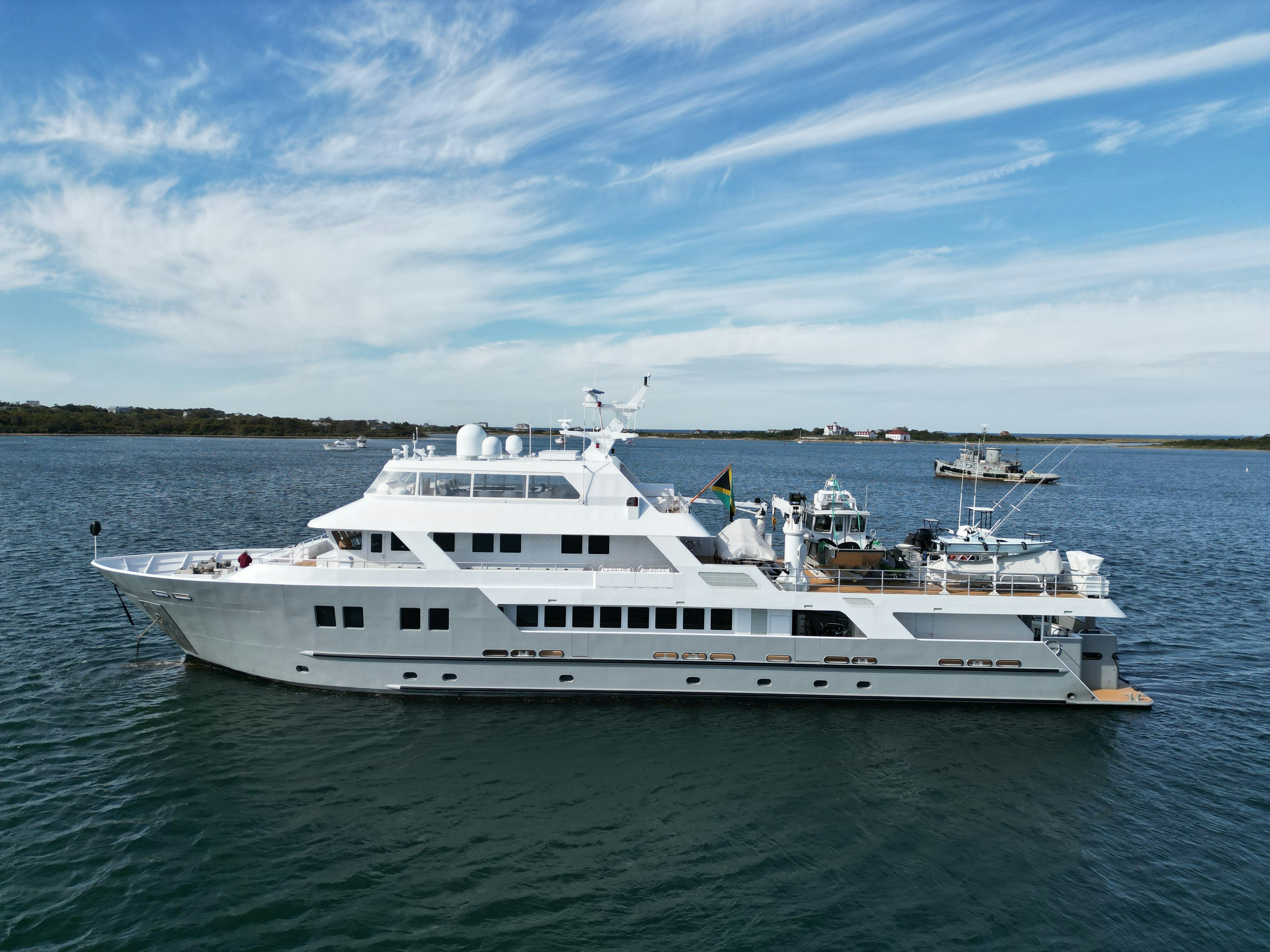 a large white boat in the water aboard COMPASS ROSE Yacht for Sale