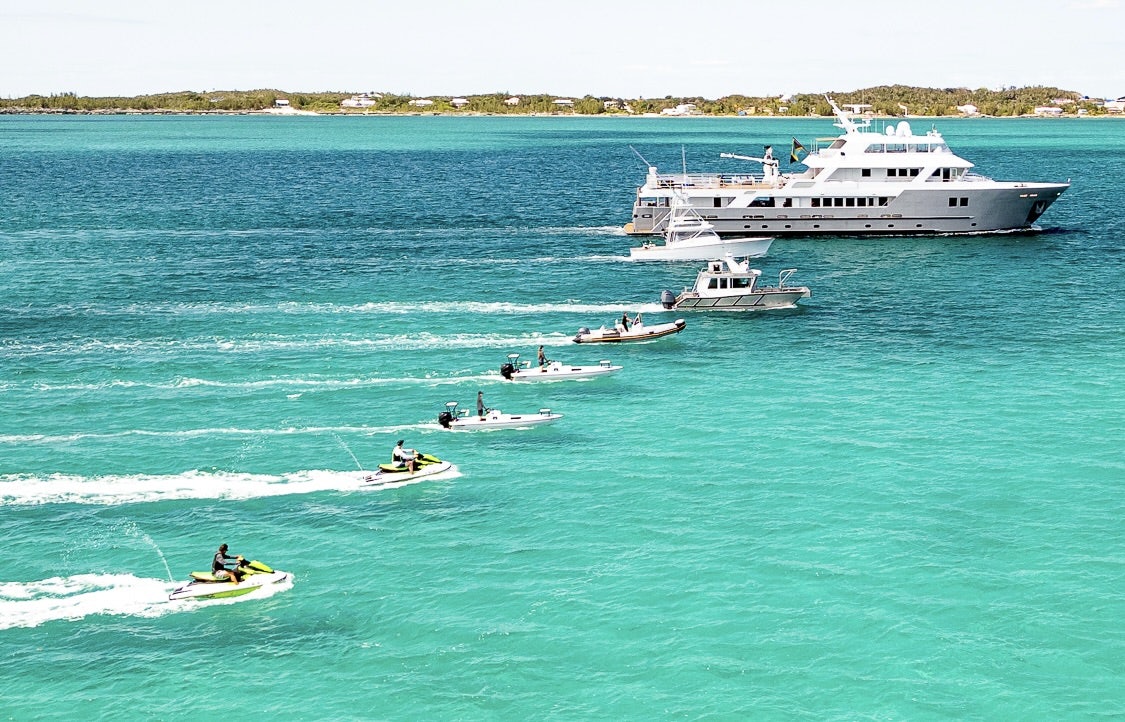 a group of people in a boat aboard COMPASS ROSE Yacht for Sale