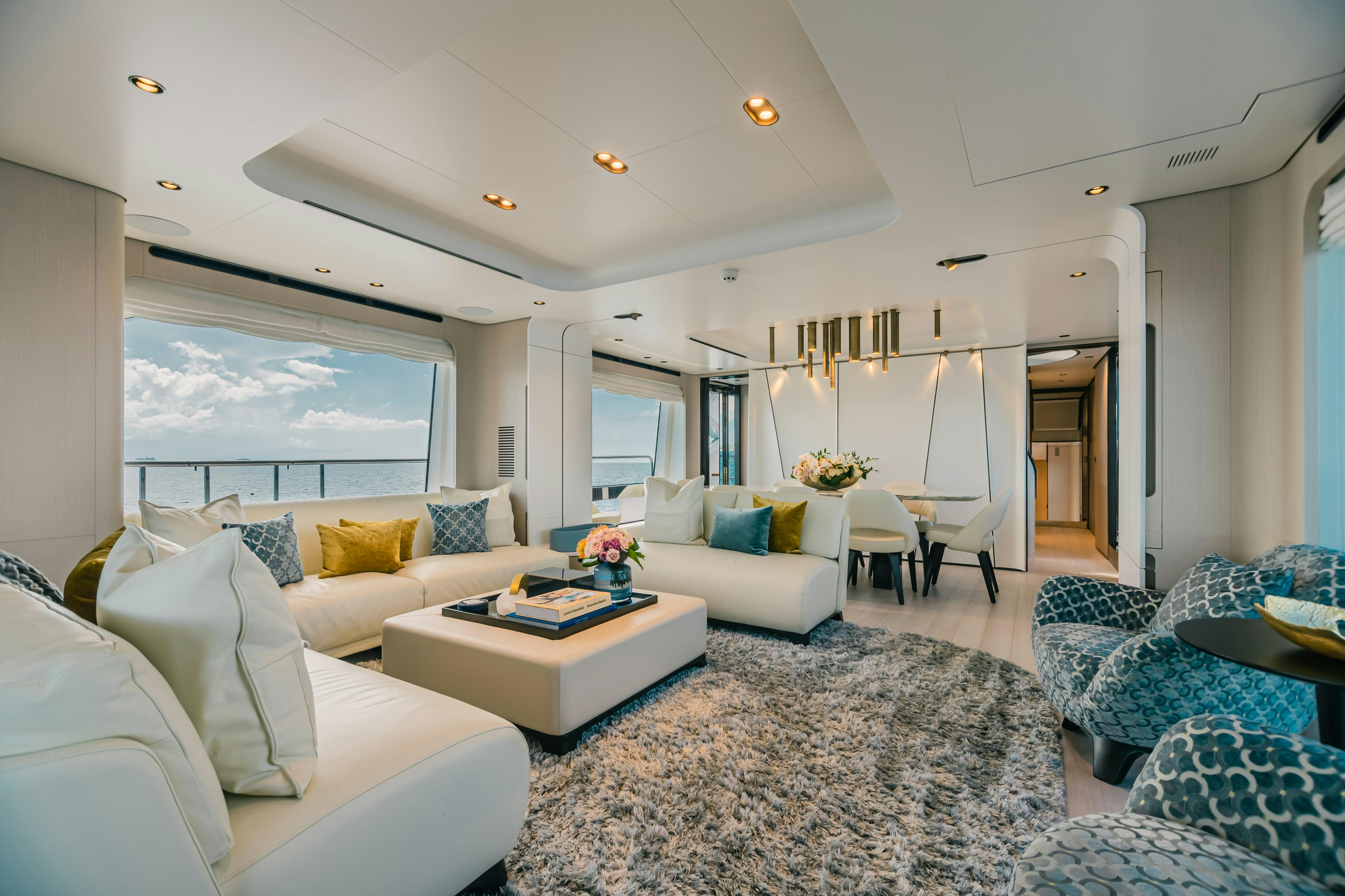 a living room with a large window aboard MAREA LA NAUTICA Yacht for Charter