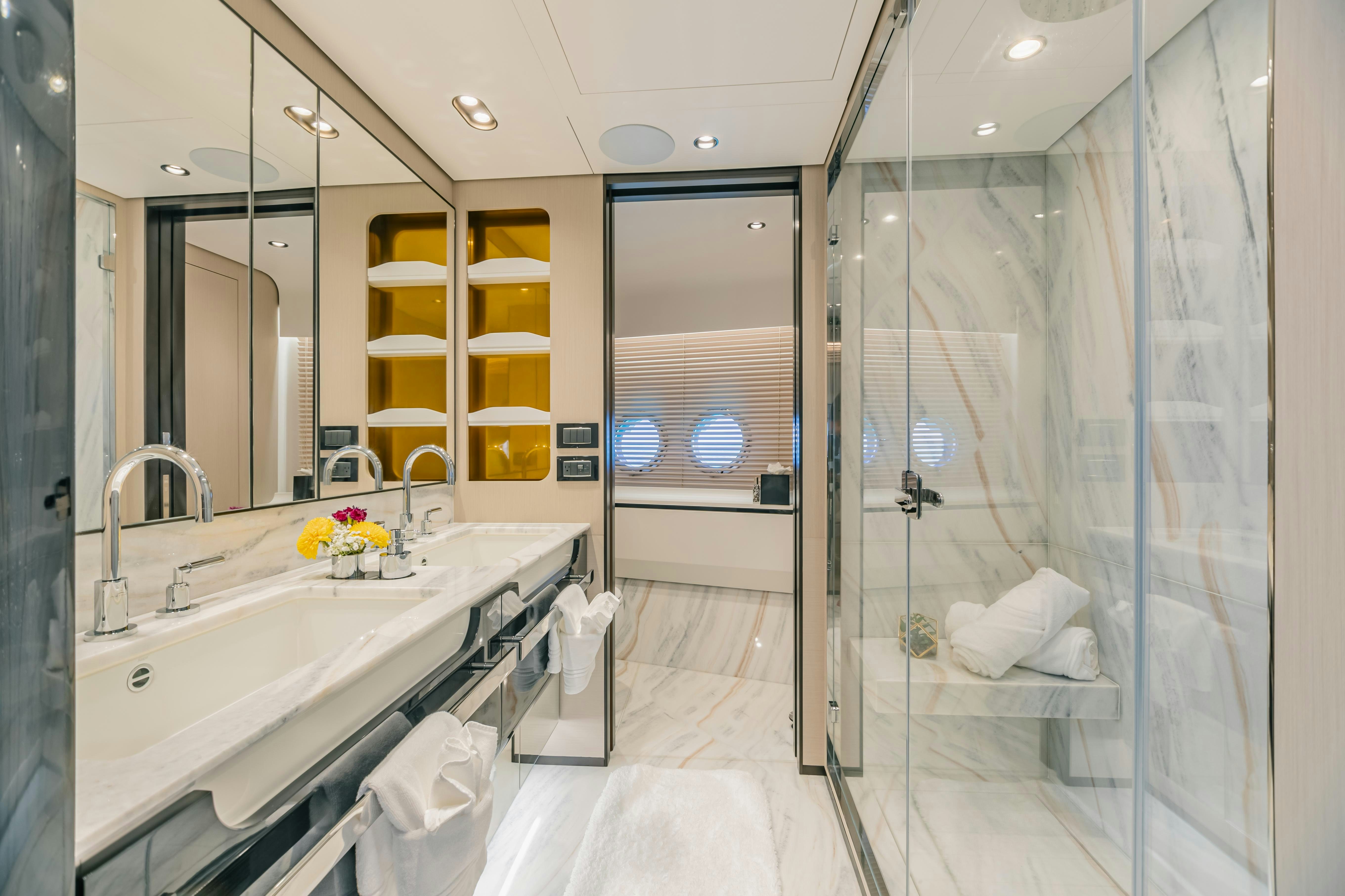 a bathroom with a glass shower aboard MAREA LA NAUTICA Yacht for Charter
