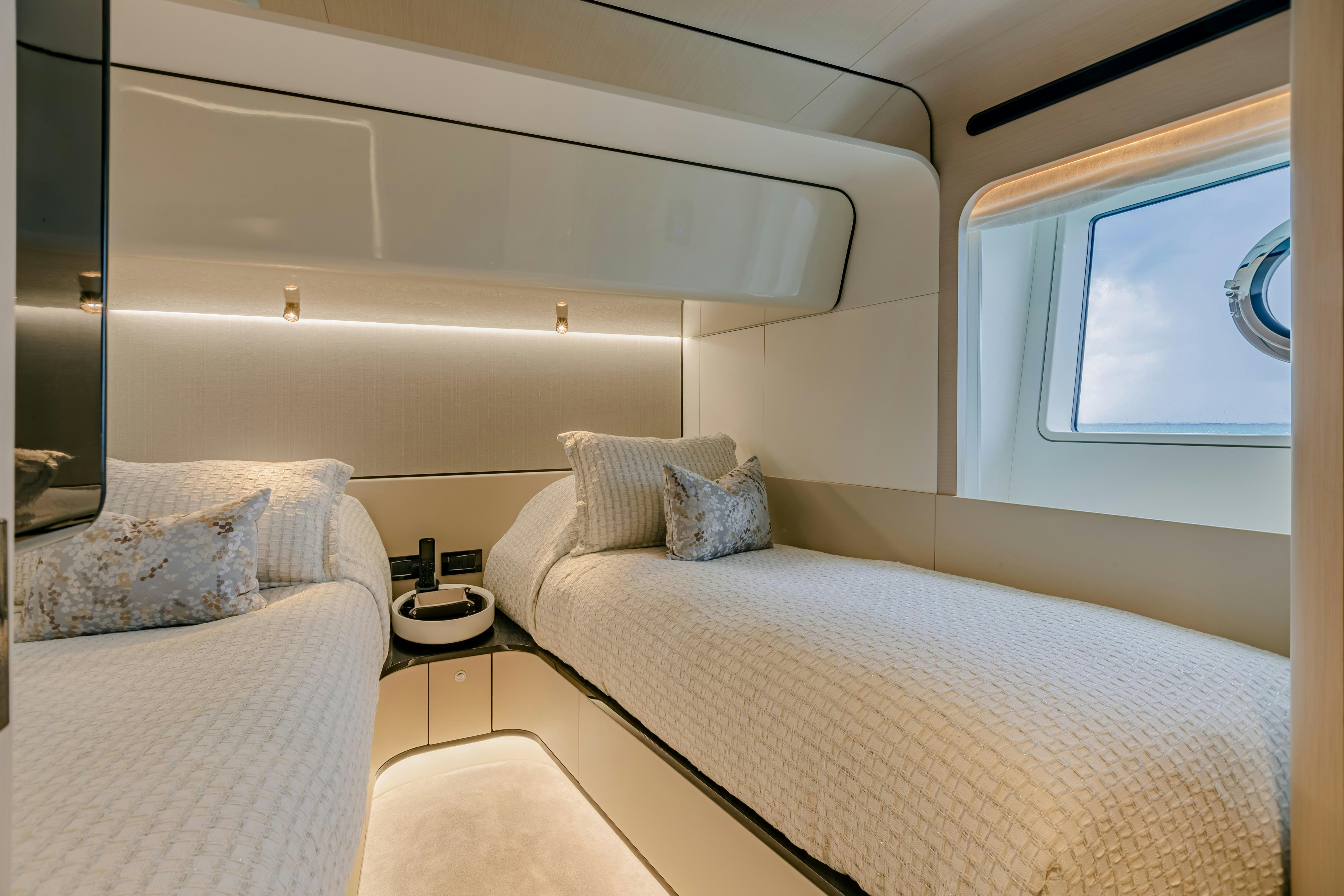 a room with a bed and a window aboard MAREA LA NAUTICA Yacht for Charter