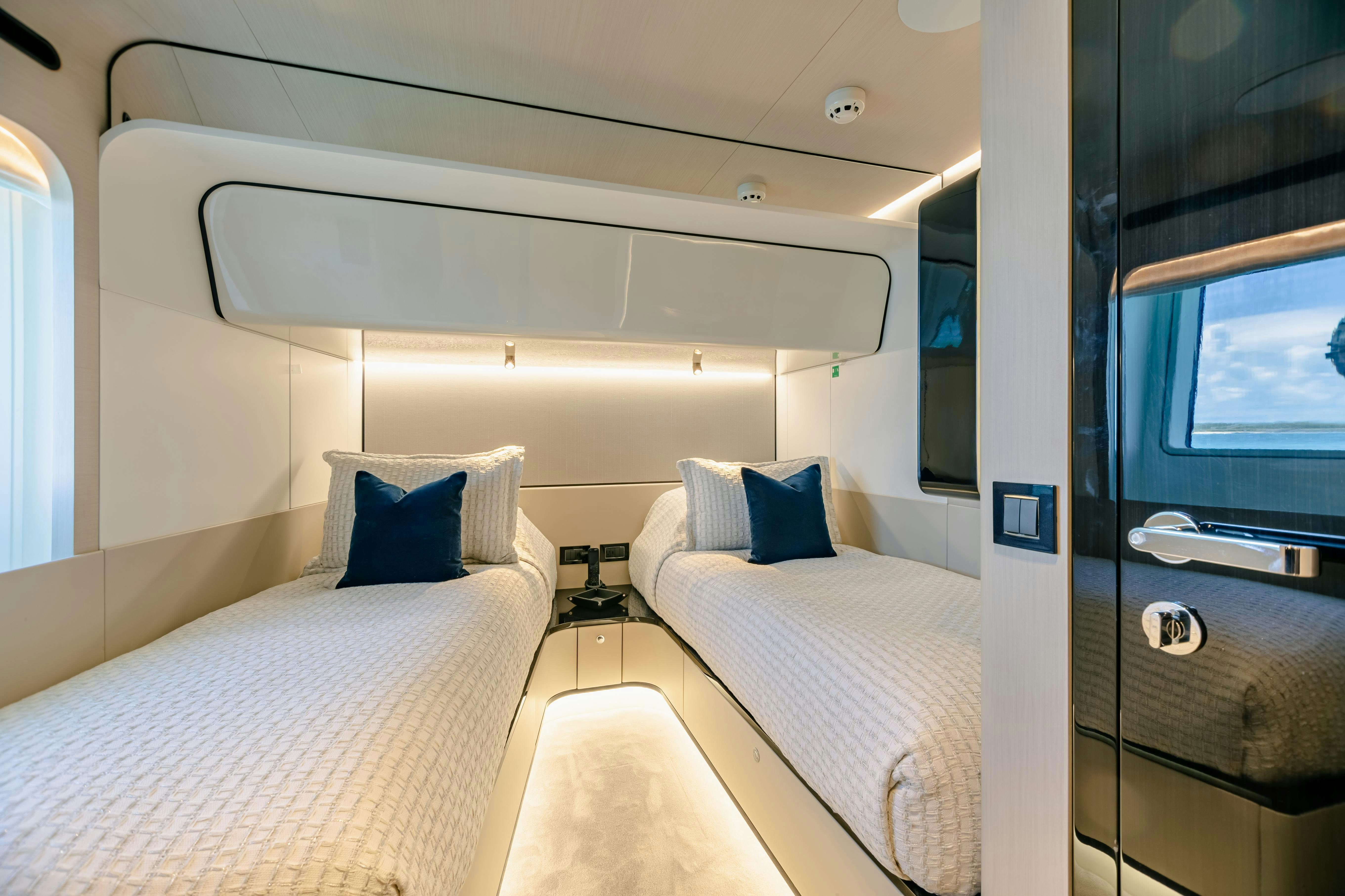 a room with two beds aboard MAREA LA NAUTICA Yacht for Charter