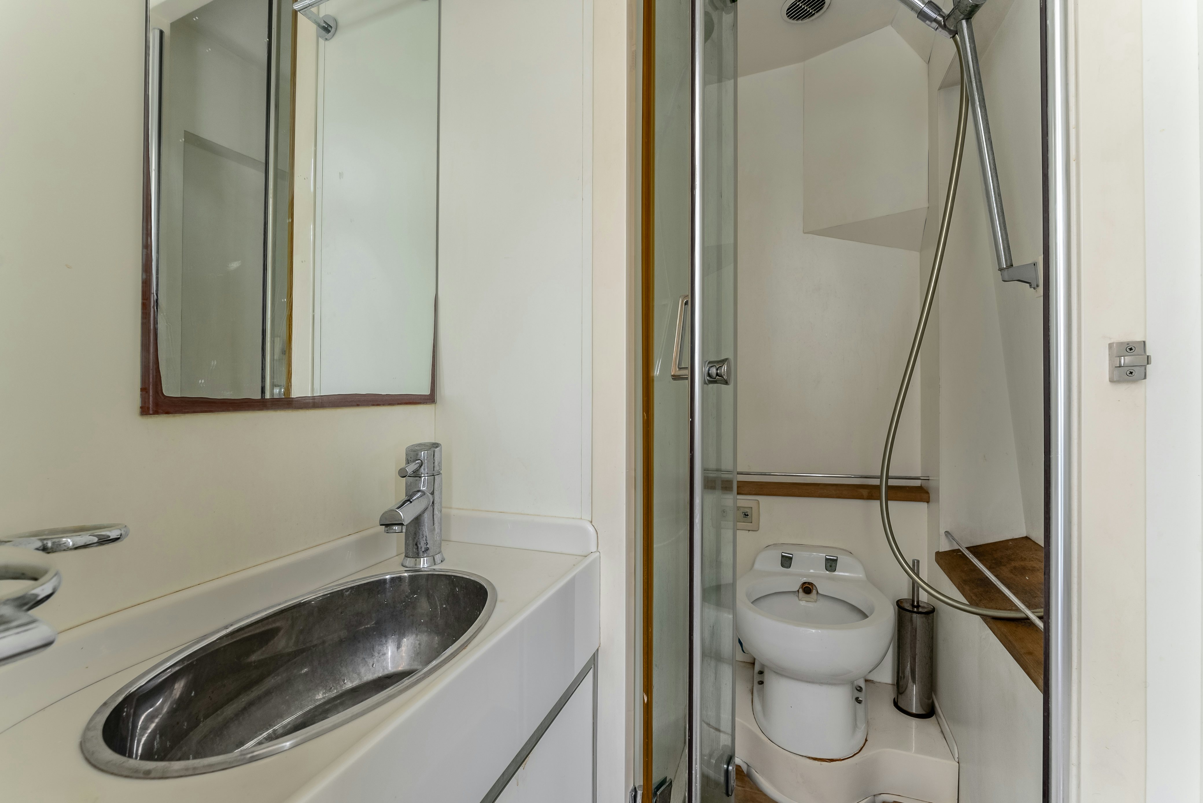 a bathroom with a sink and a toilet aboard LADY F Yacht for Sale