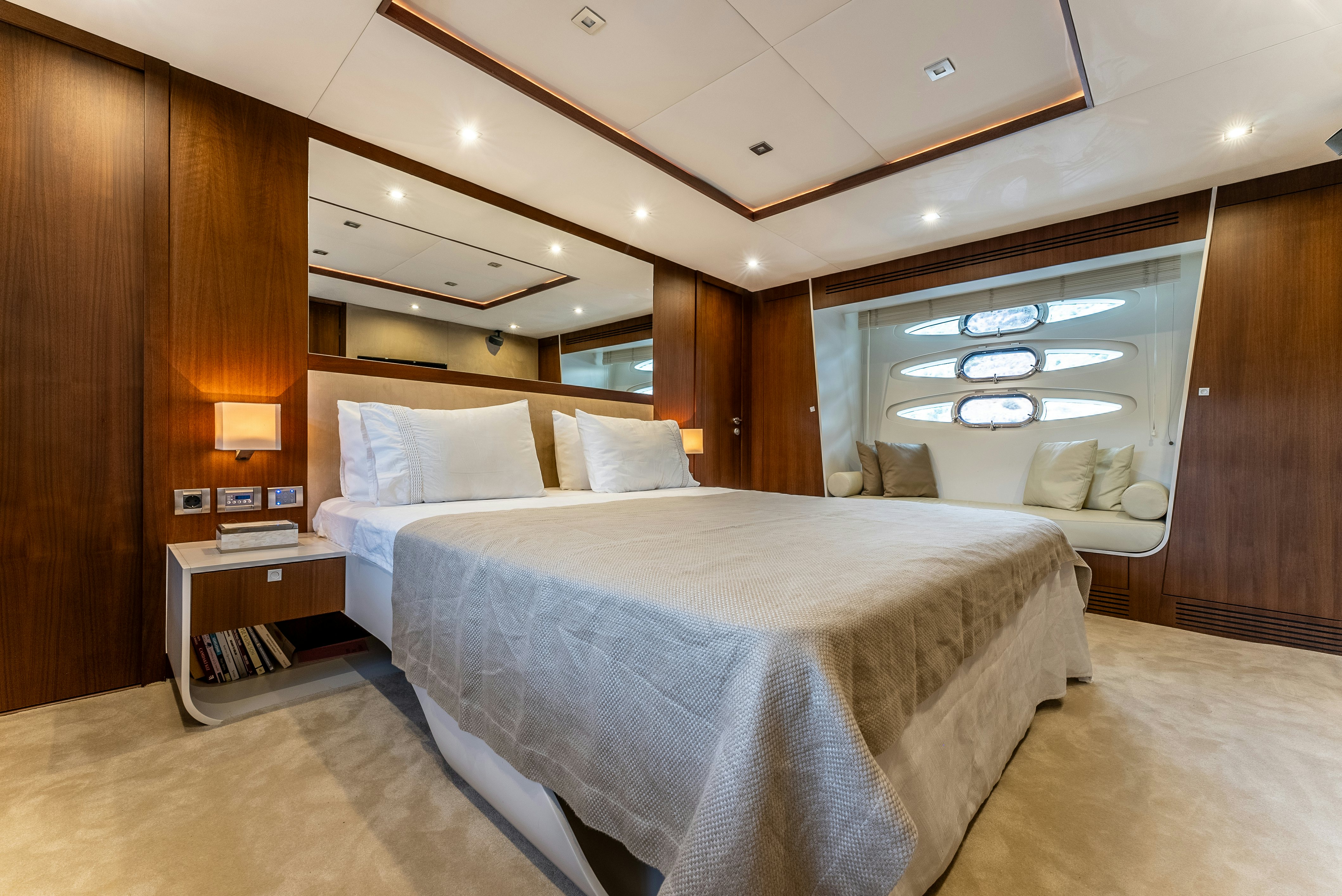 a room with a bed and a wood wall aboard LADY F Yacht for Sale