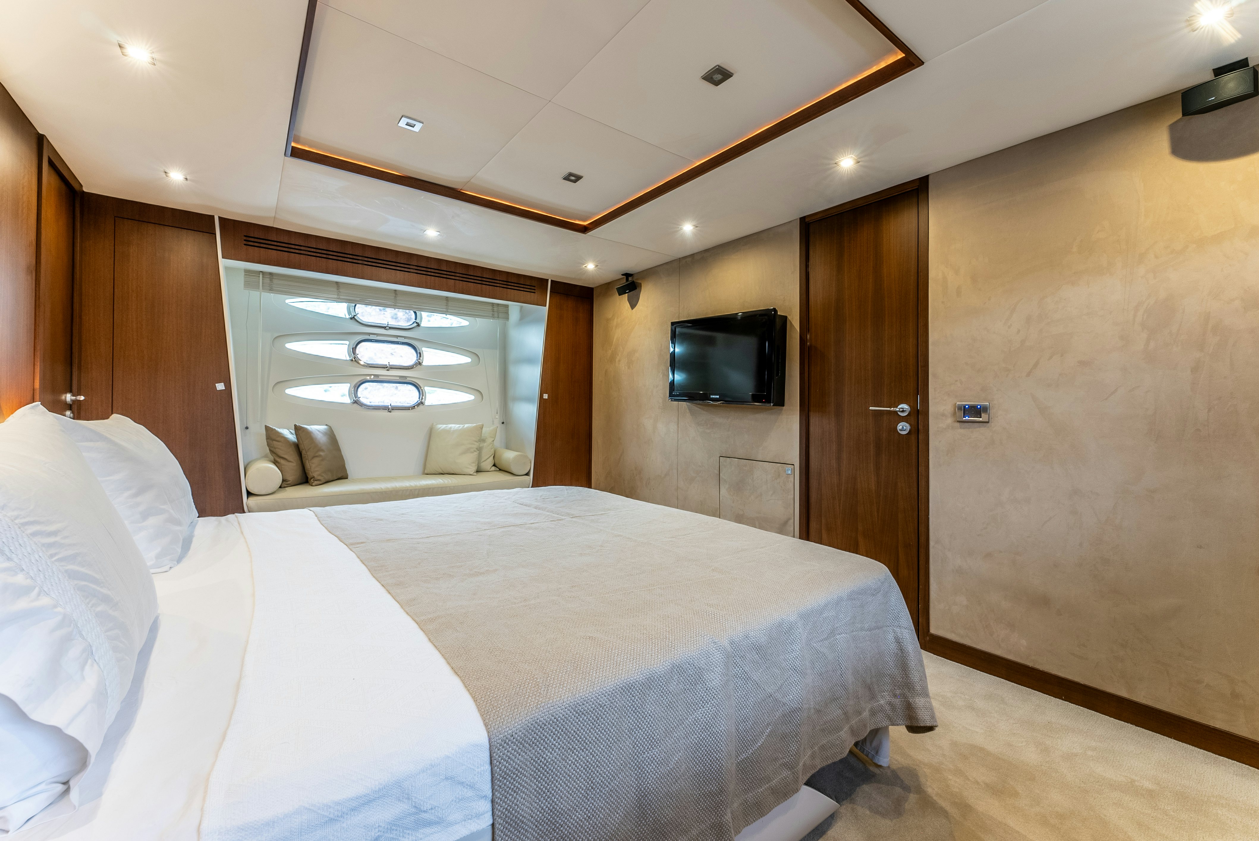 a hotel room with a bed and tv aboard LADY F Yacht for Sale