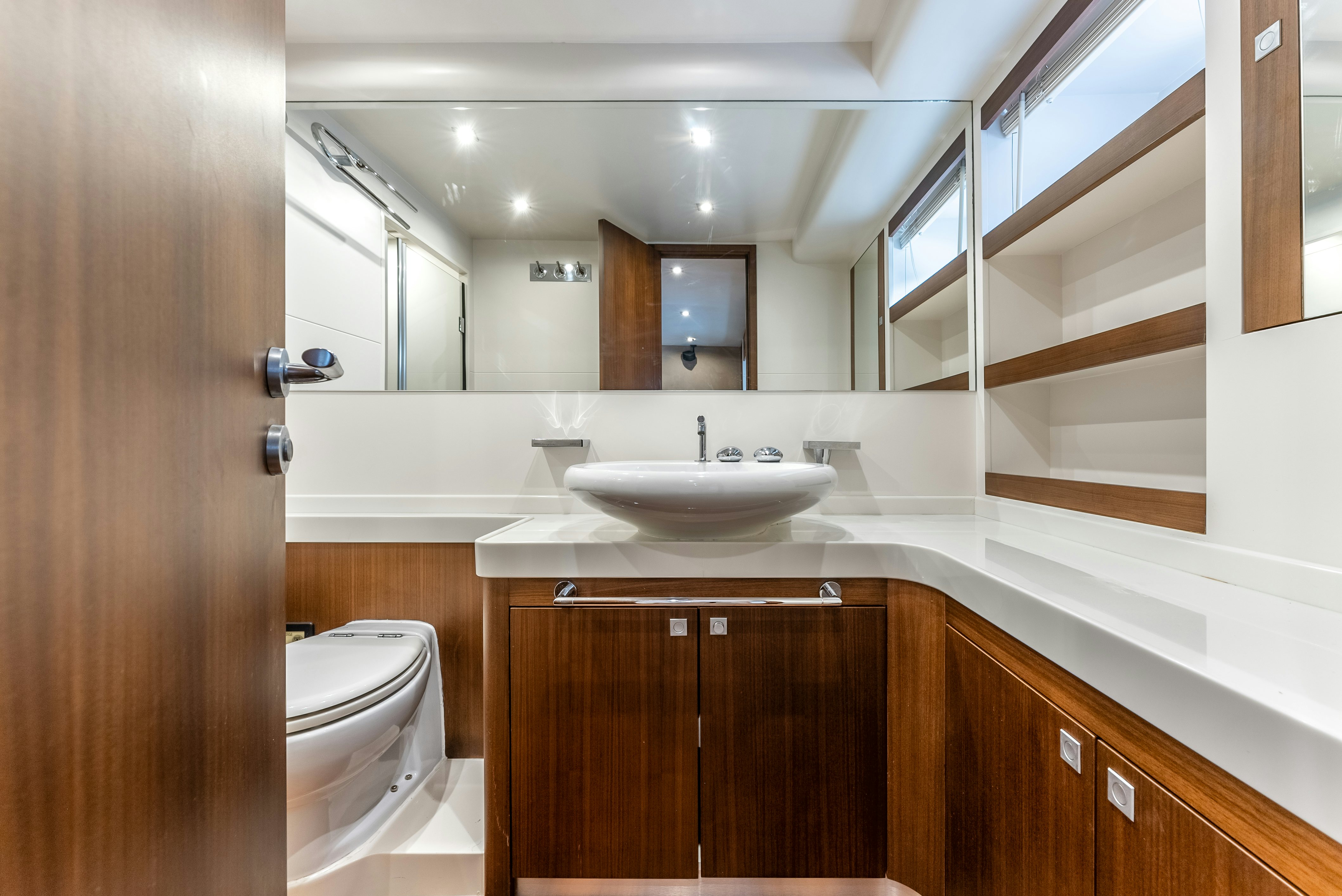a bathroom with a sink and a toilet aboard LADY F Yacht for Sale