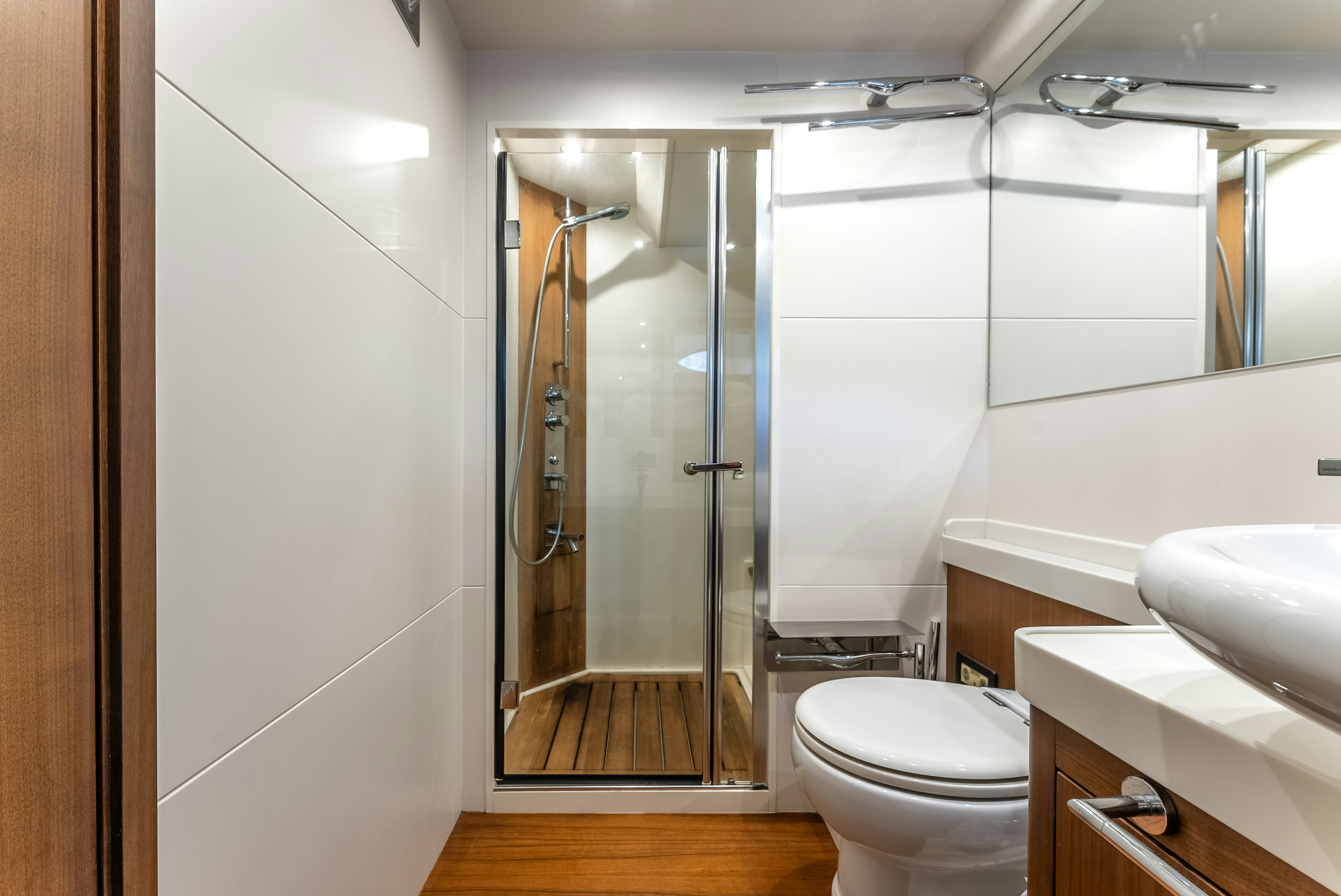 a bathroom with a glass shower aboard LADY F Yacht for Sale
