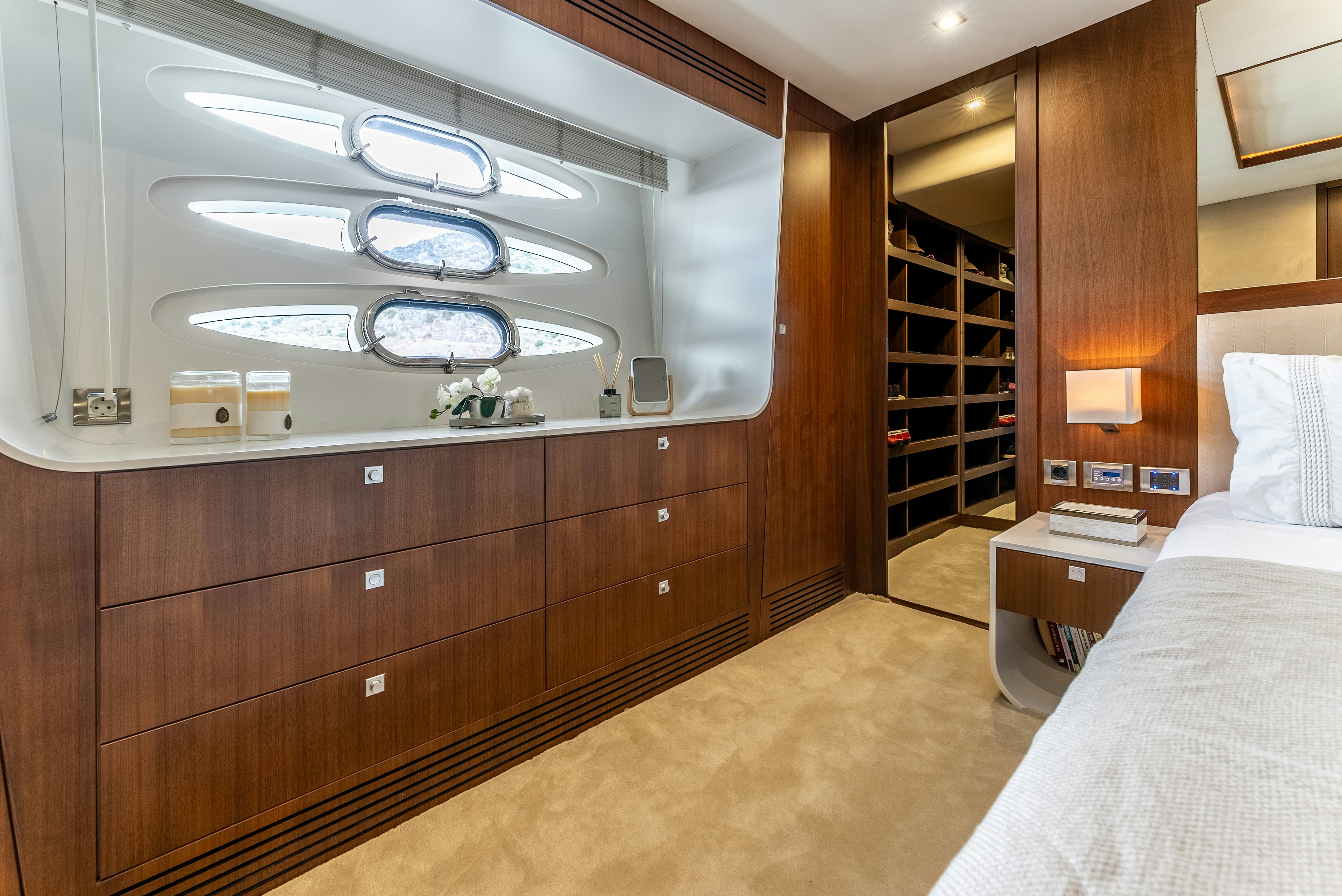 a room with a bed and a mirror aboard LADY F Yacht for Sale