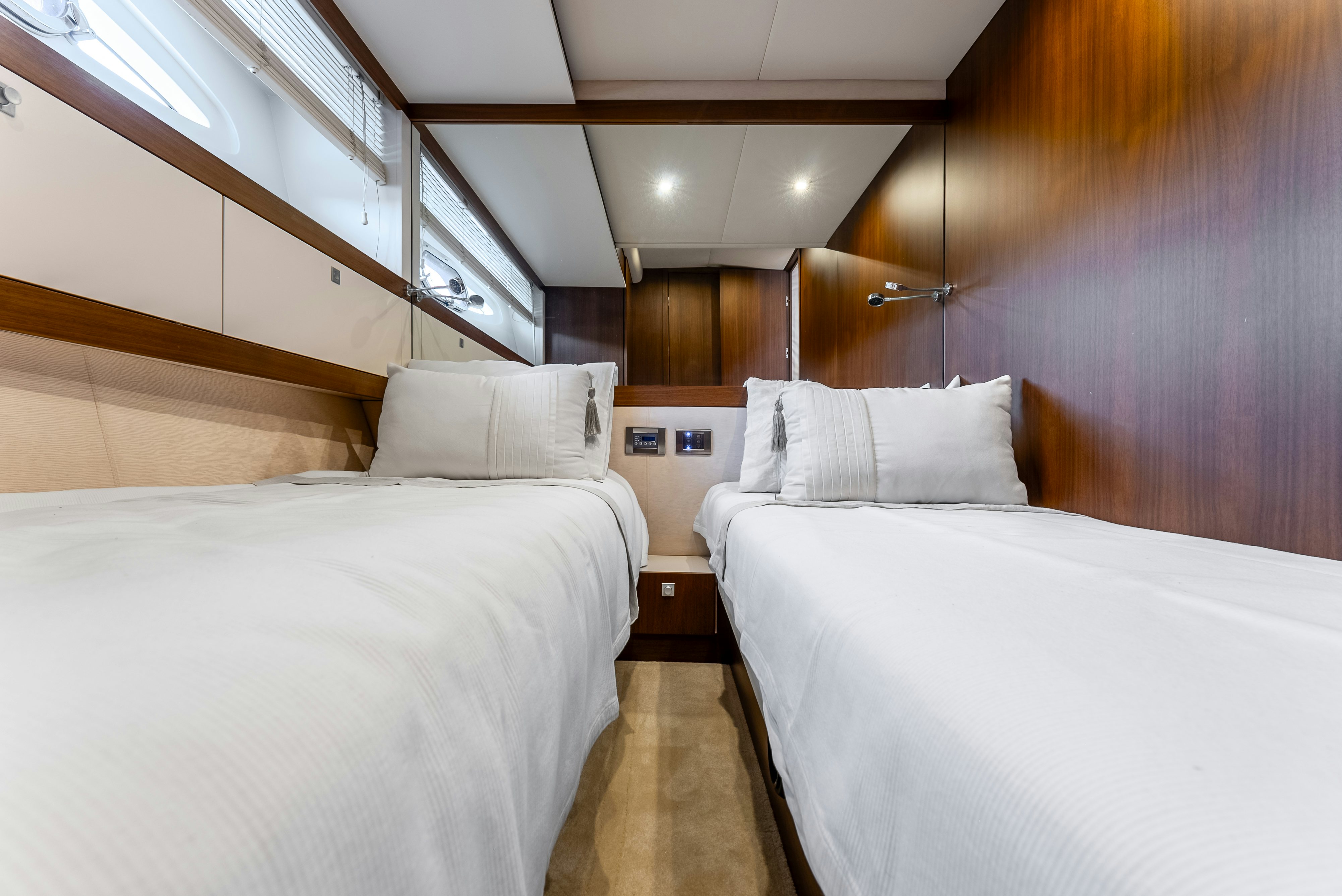 a room with two beds aboard LADY F Yacht for Sale