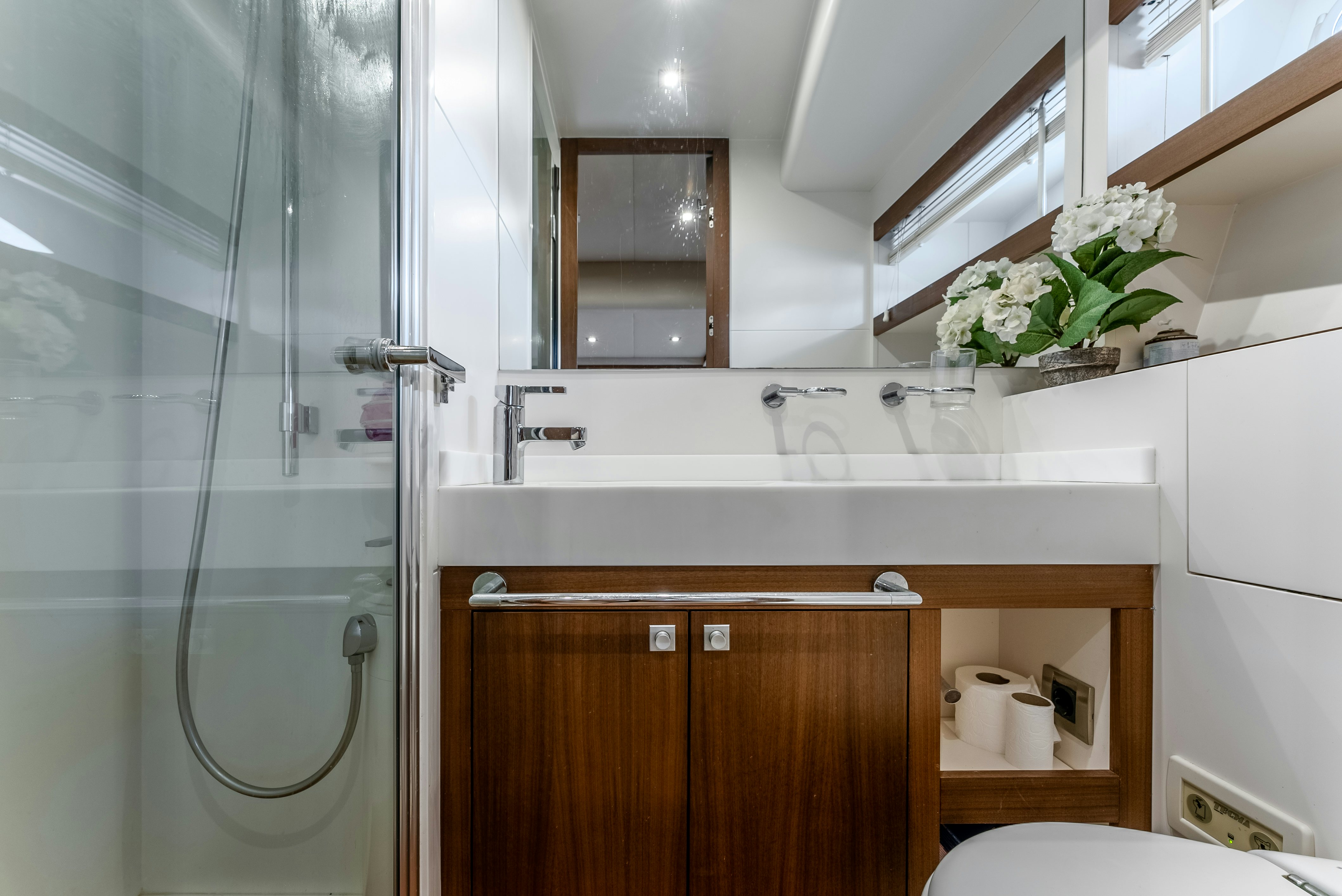a bathroom with a glass shower aboard LADY F Yacht for Sale