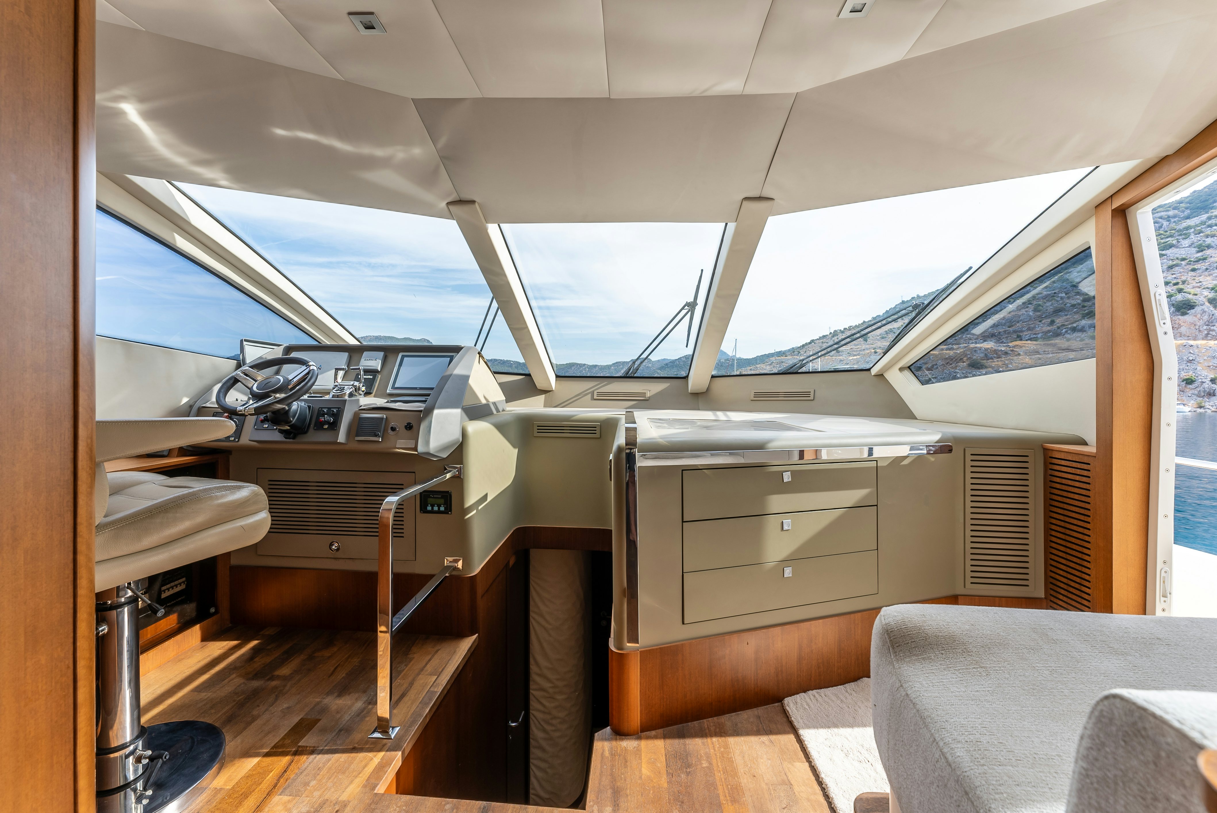 a room with a bed and desk aboard LADY F Yacht for Sale