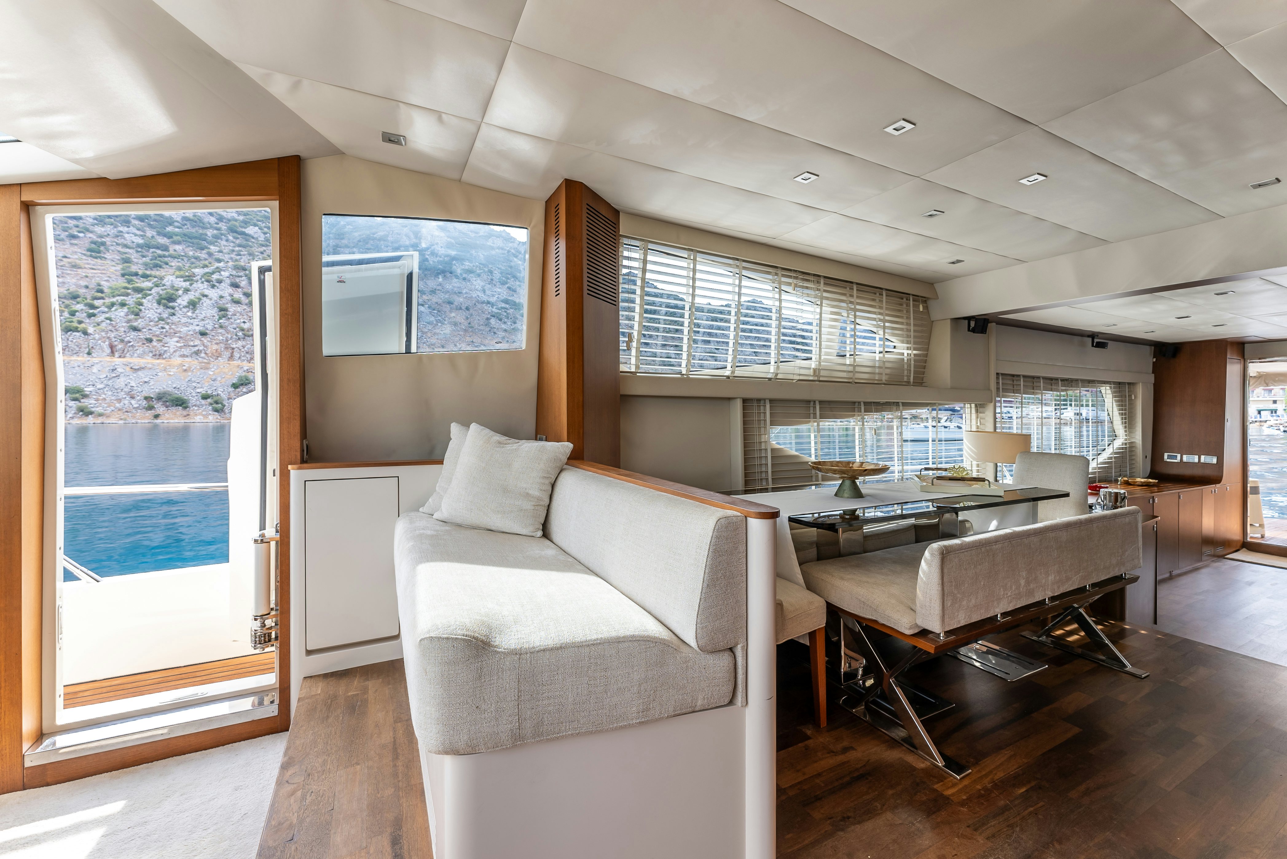 a living room with a large window aboard LADY F Yacht for Sale
