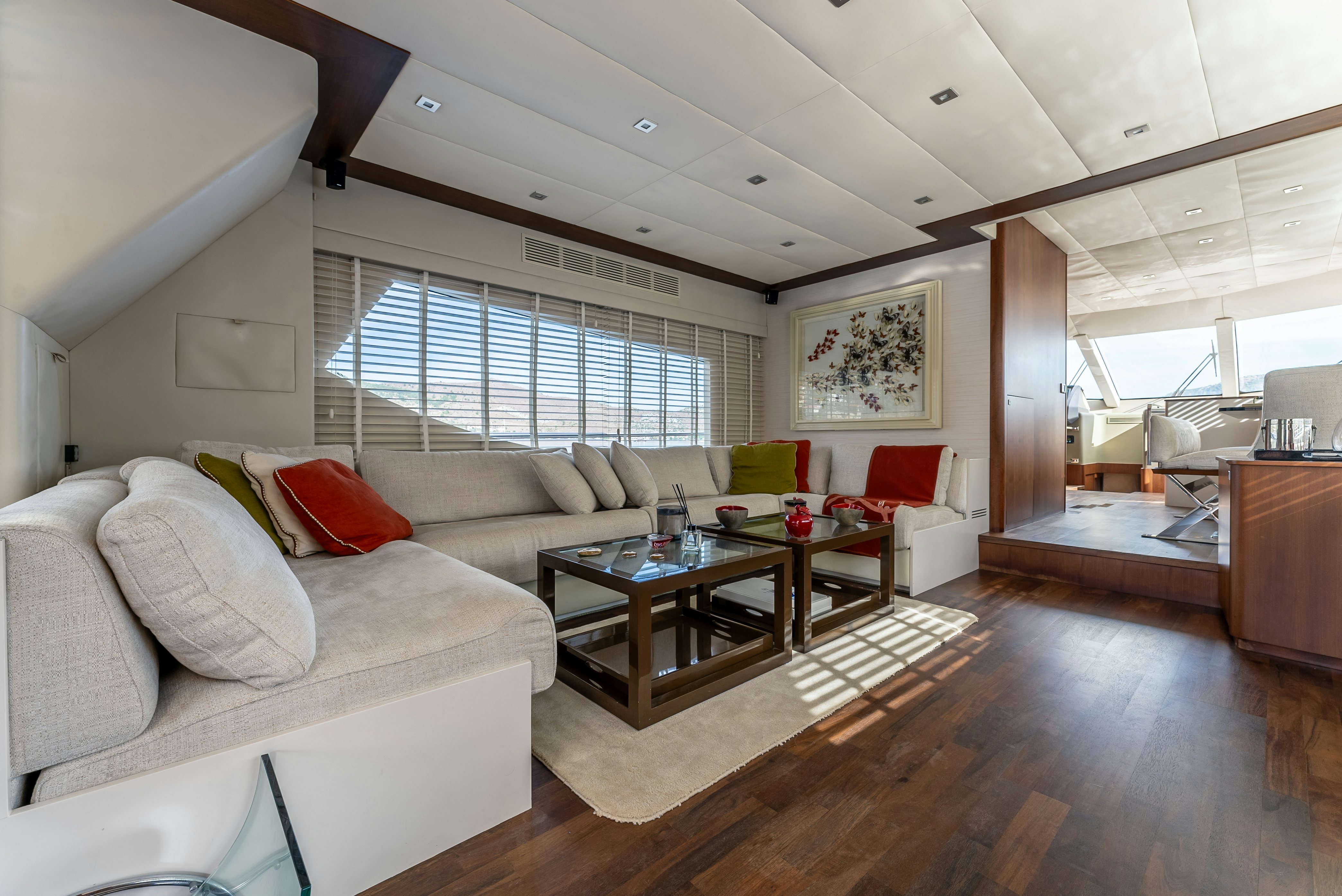 a living room with a couch and a table aboard LADY F Yacht for Sale