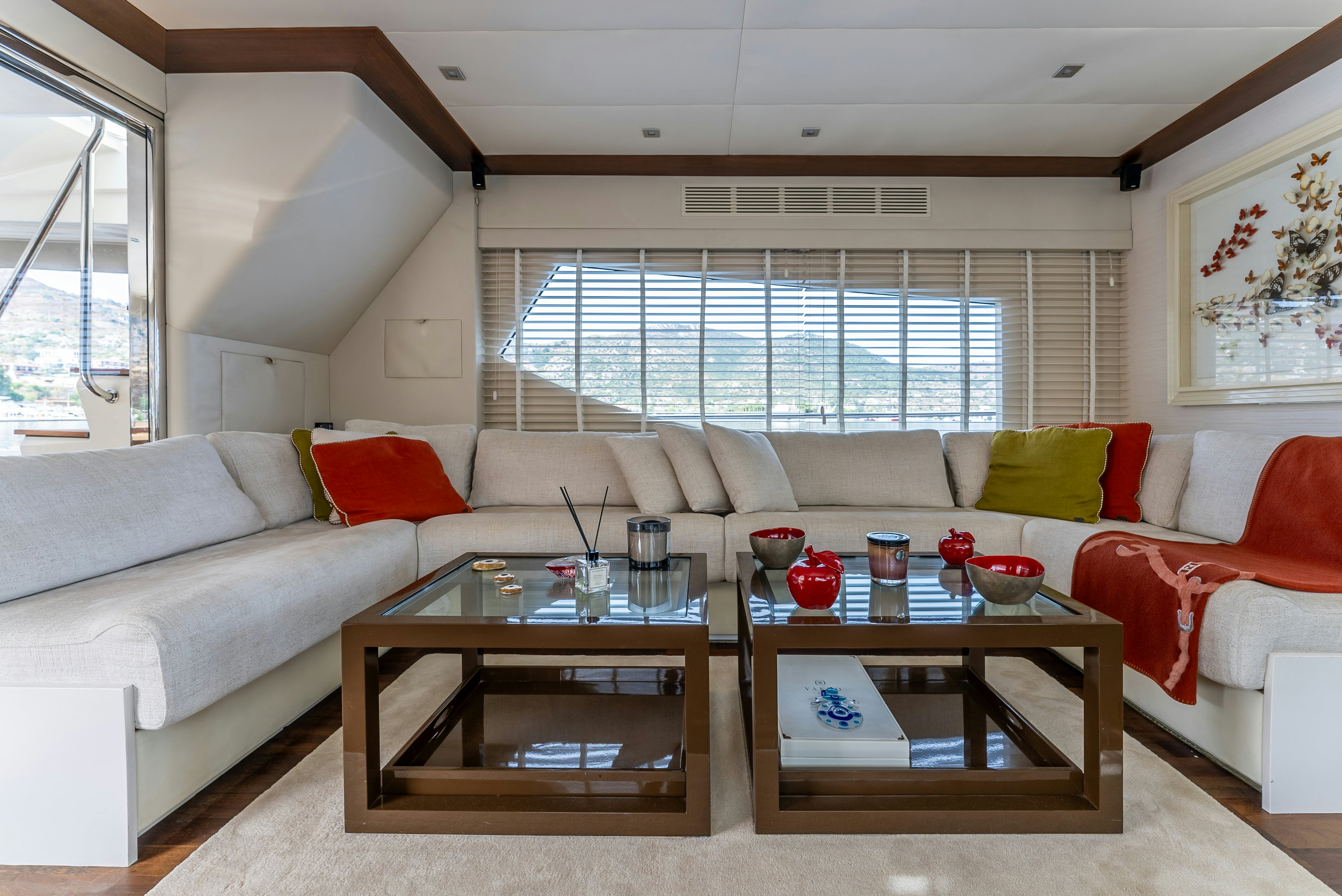 a living room with a white couch and a coffee table aboard LADY F Yacht for Sale