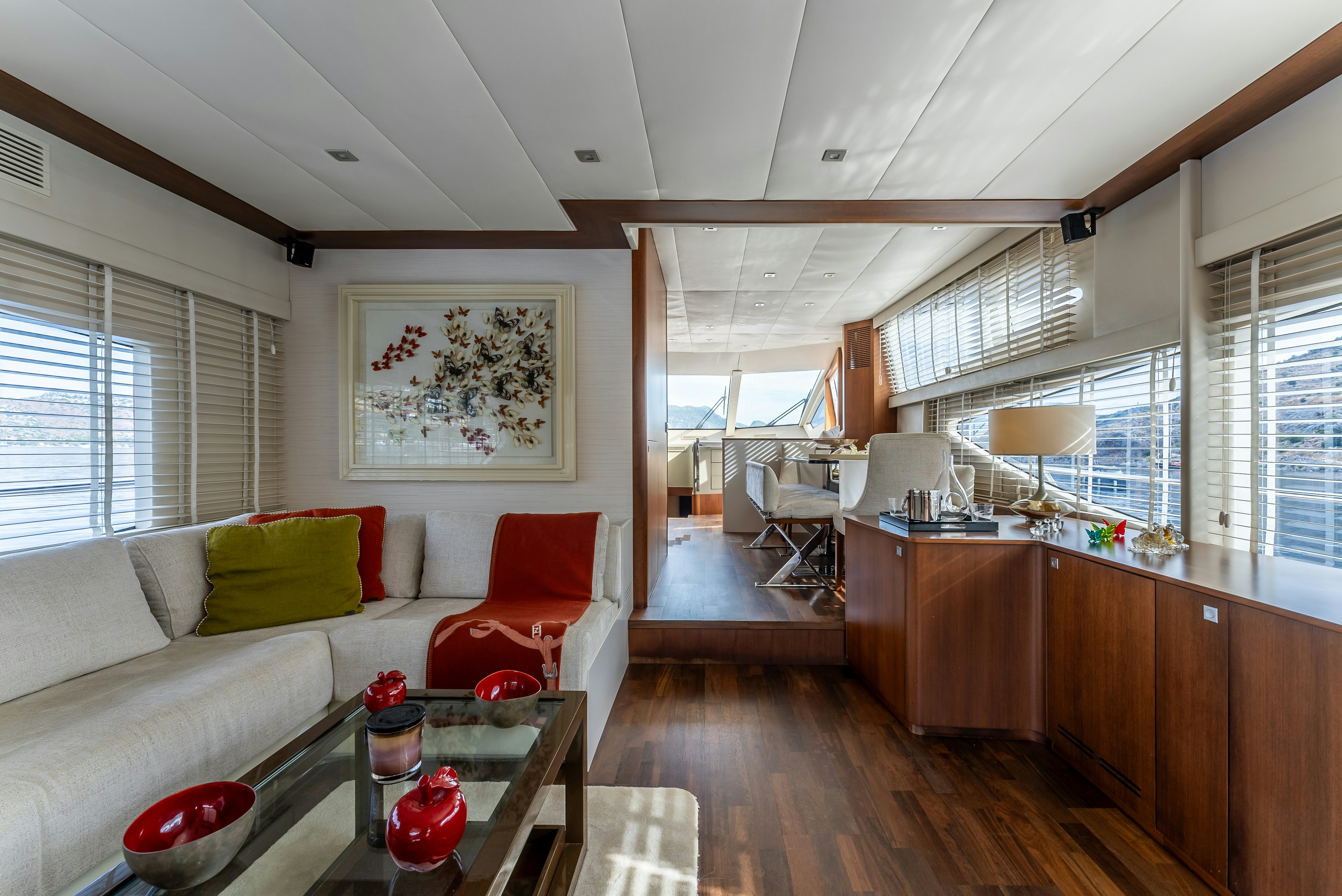 a living room with a couch and a table aboard LADY F Yacht for Sale