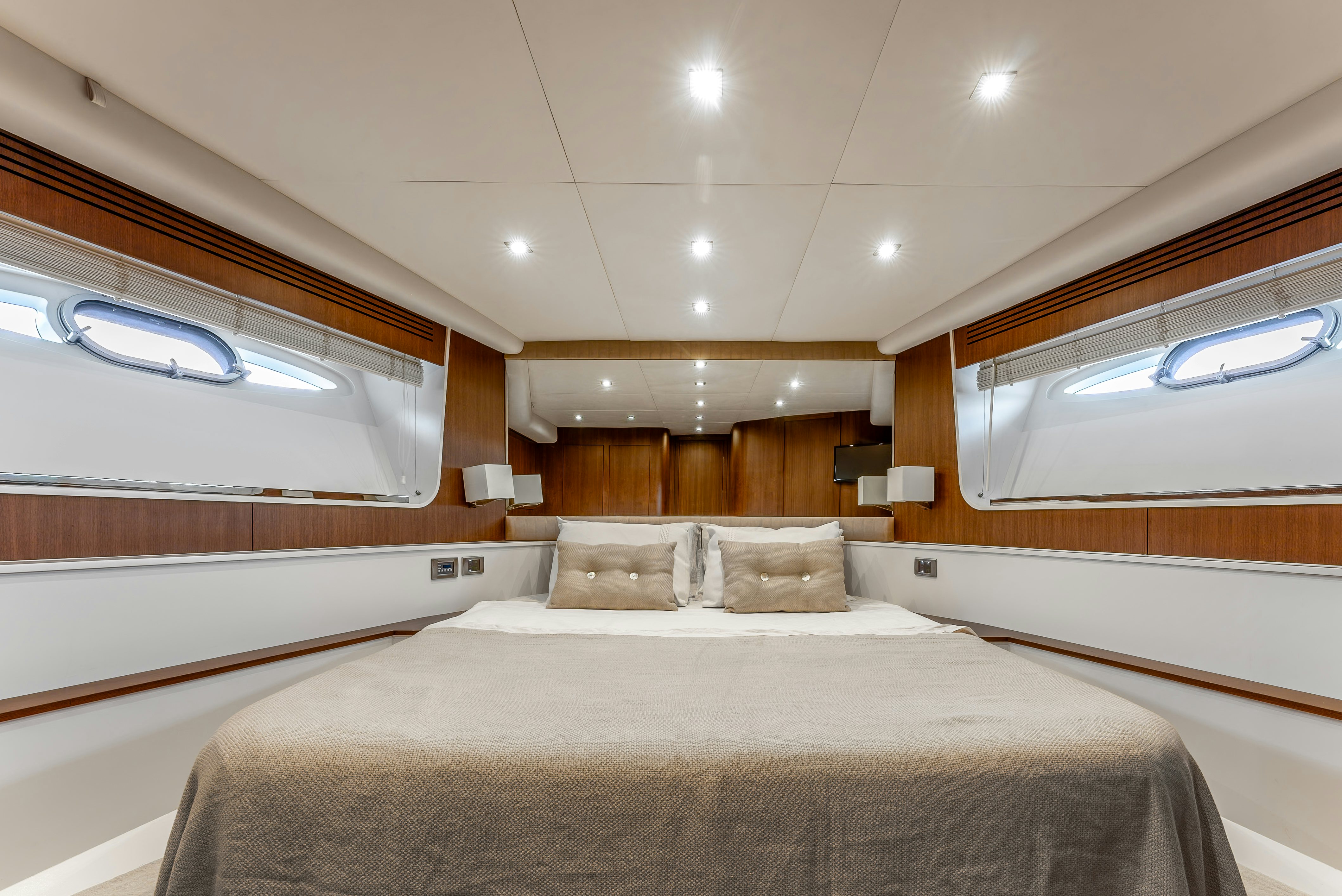 a room with a bed and a window aboard LADY F Yacht for Sale
