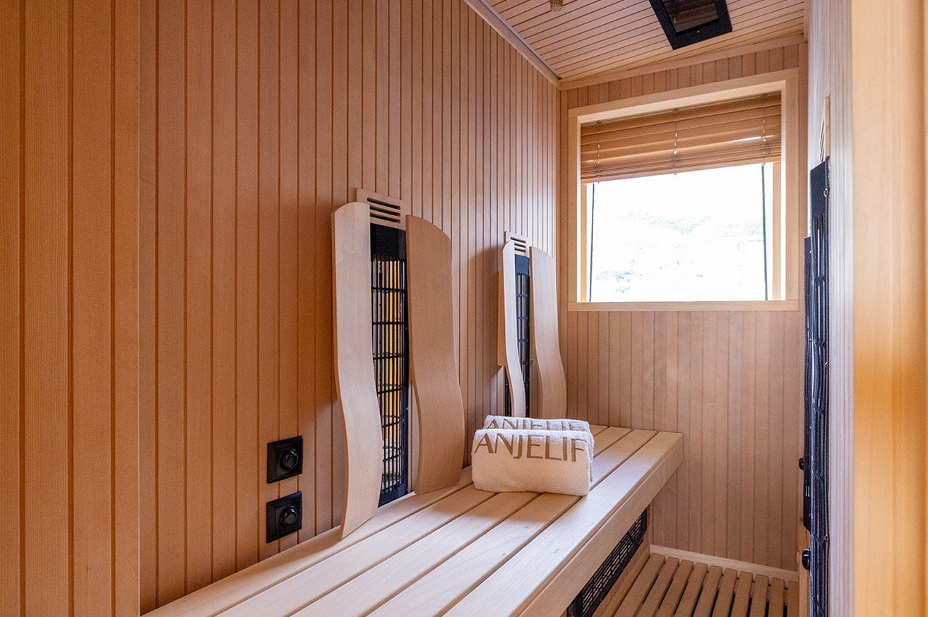 a wood shelf with a computer on it aboard ANJELIF Yacht for Charter
