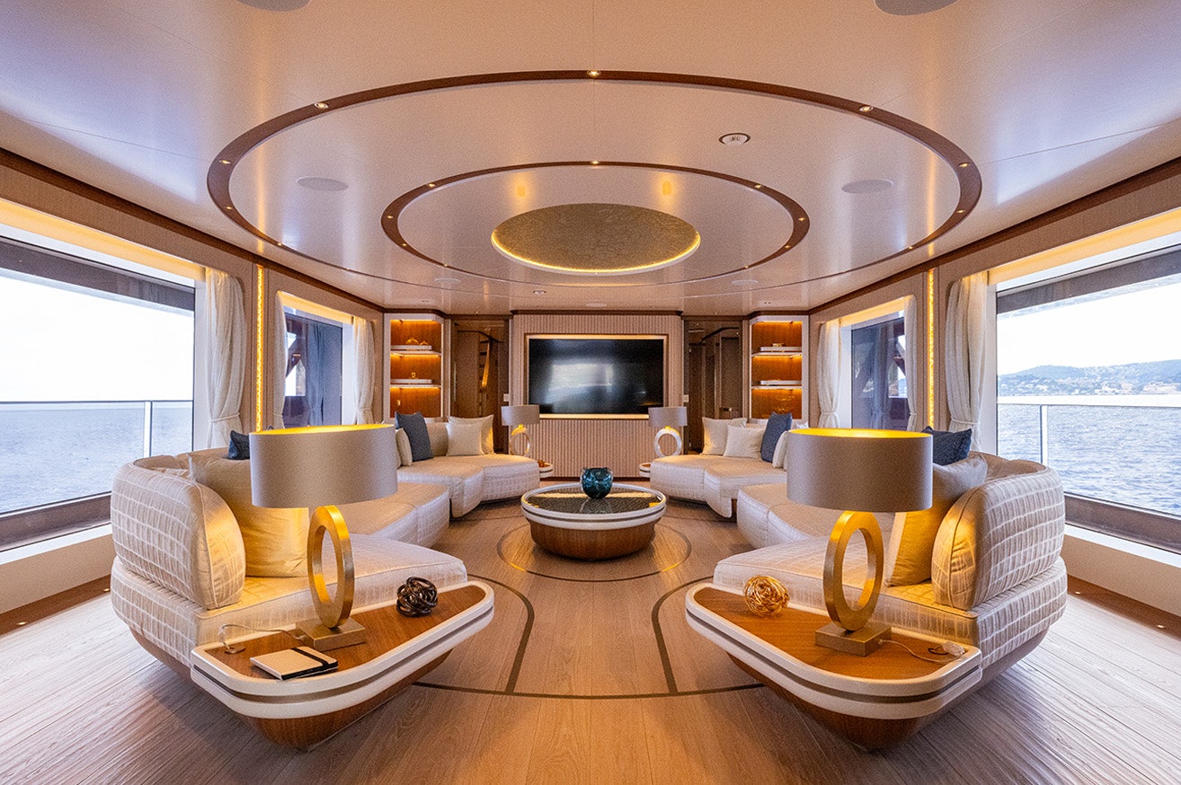 a living room with a large mirror aboard ANJELIF Yacht for Charter