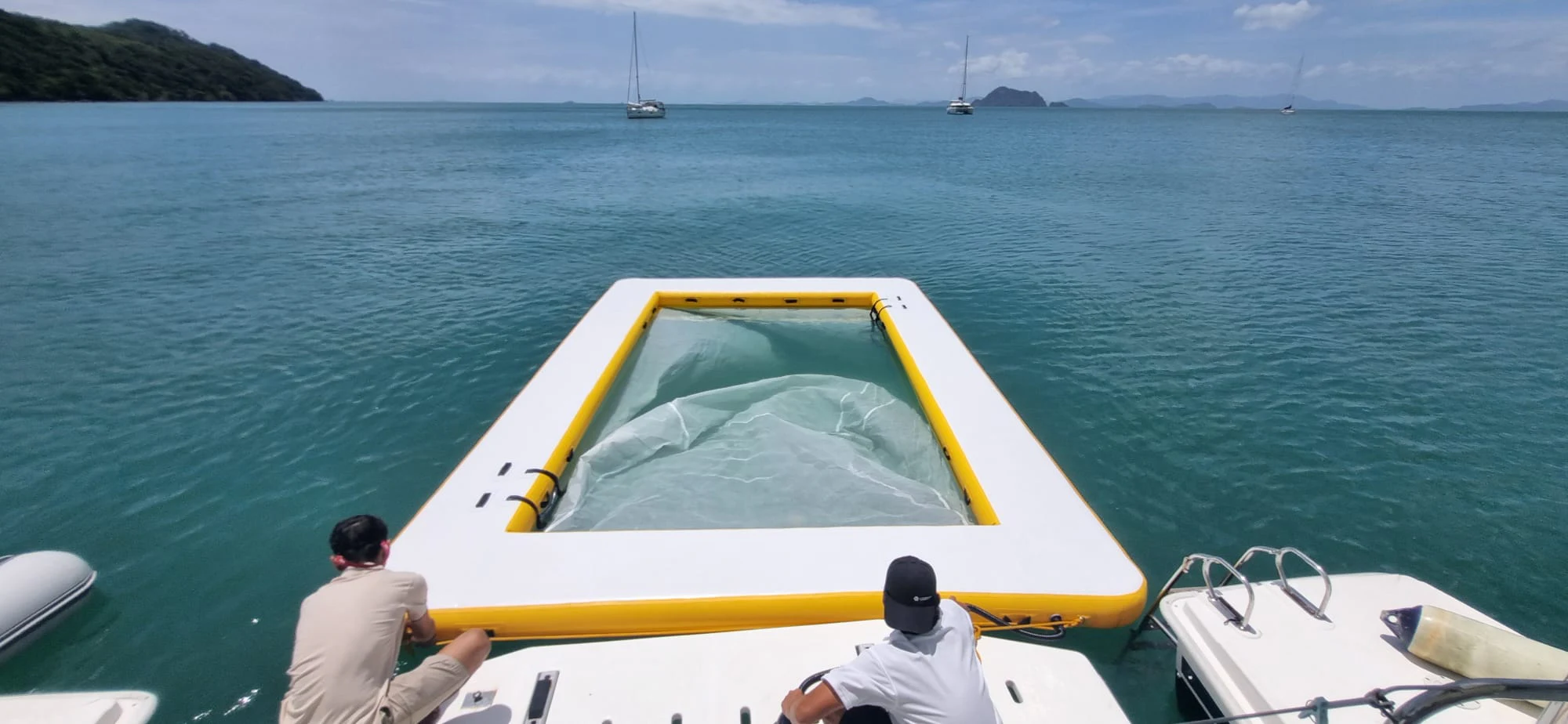 a man on a boat aboard HARMONY CAT Yacht for Sale