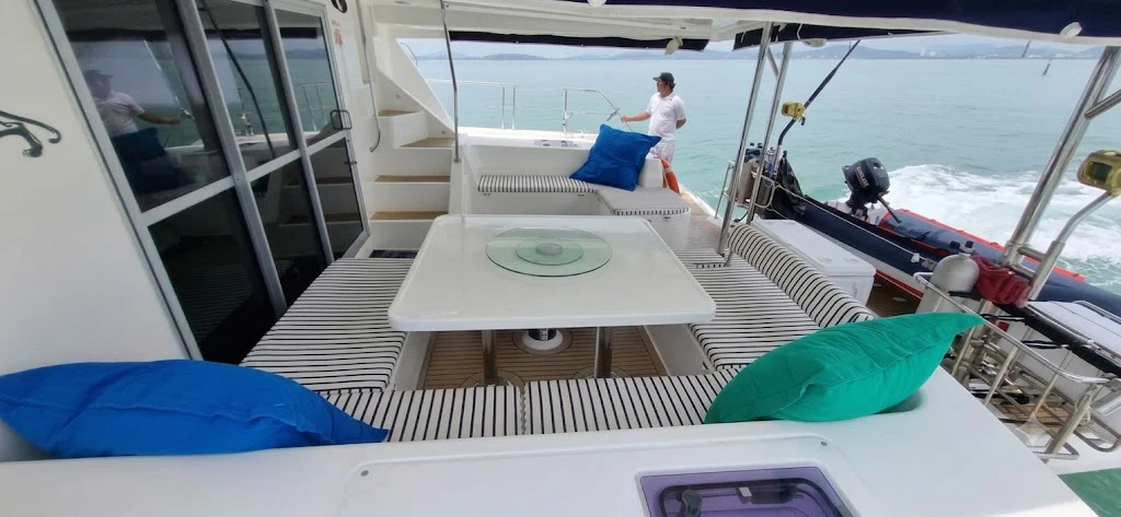 a person sitting on a boat aboard HARMONY CAT Yacht for Sale