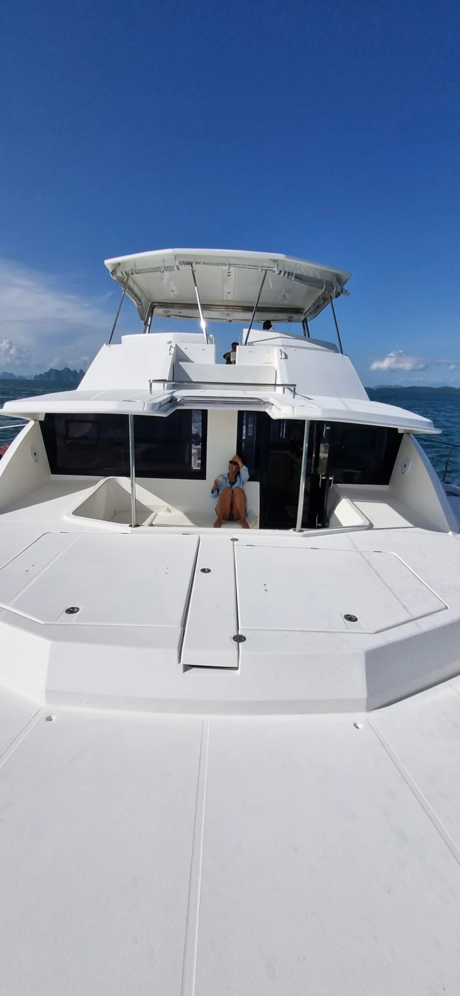 a person standing on a boat aboard HARMONY CAT Yacht for Sale