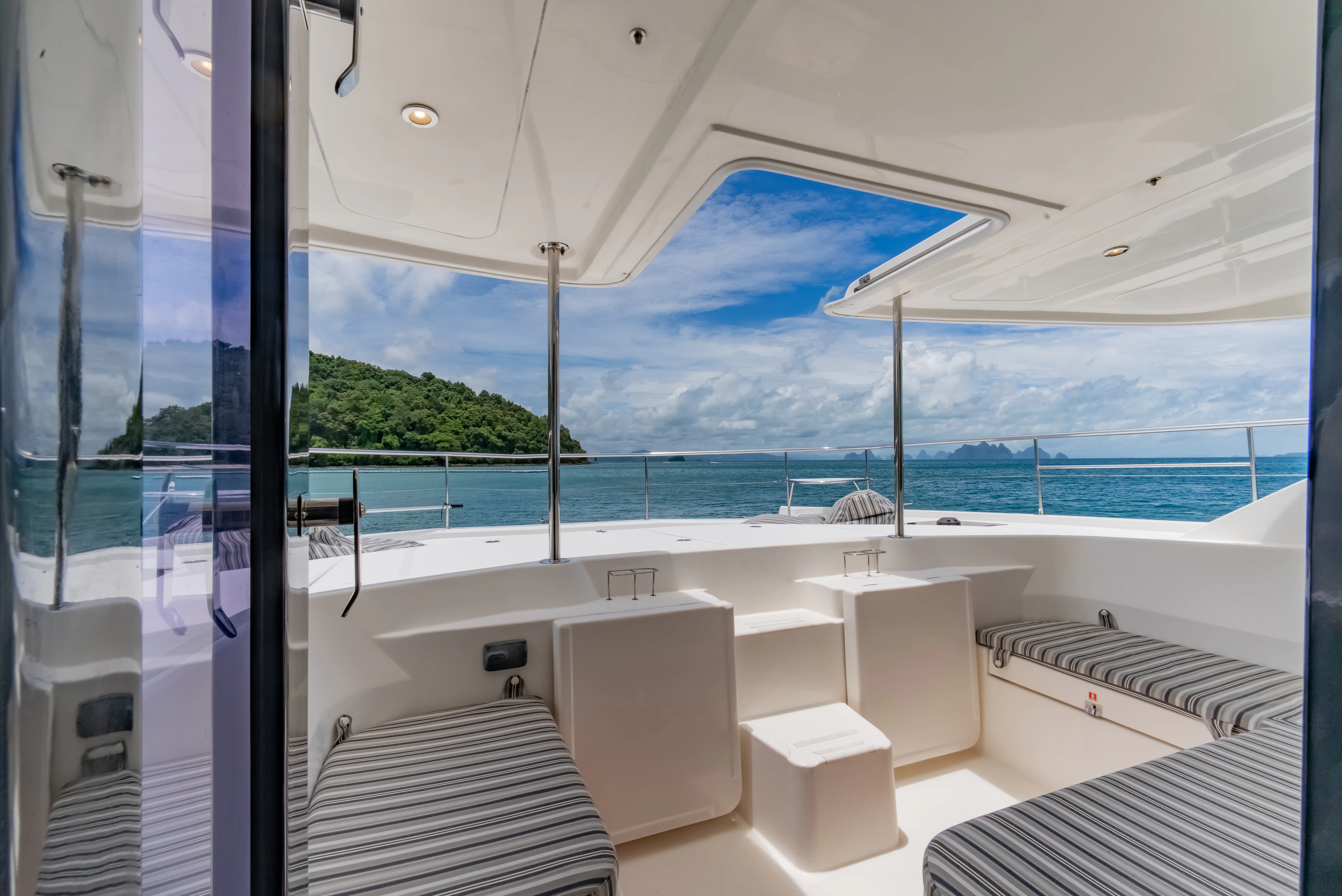 a room with a view of the ocean and the ocean aboard HARMONY CAT Yacht for Sale
