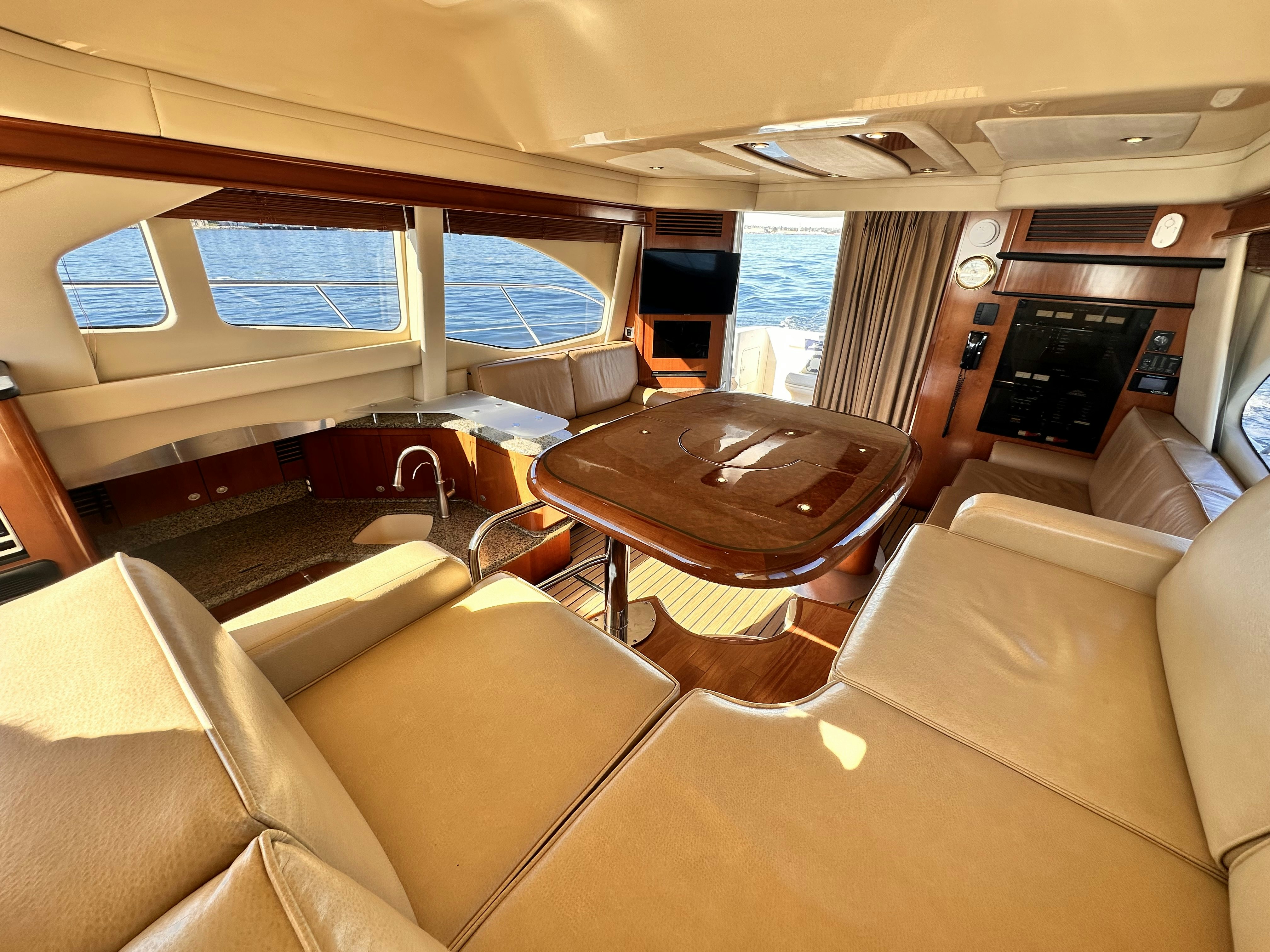 a train with a table and chairs aboard LANAKILA Yacht for Sale