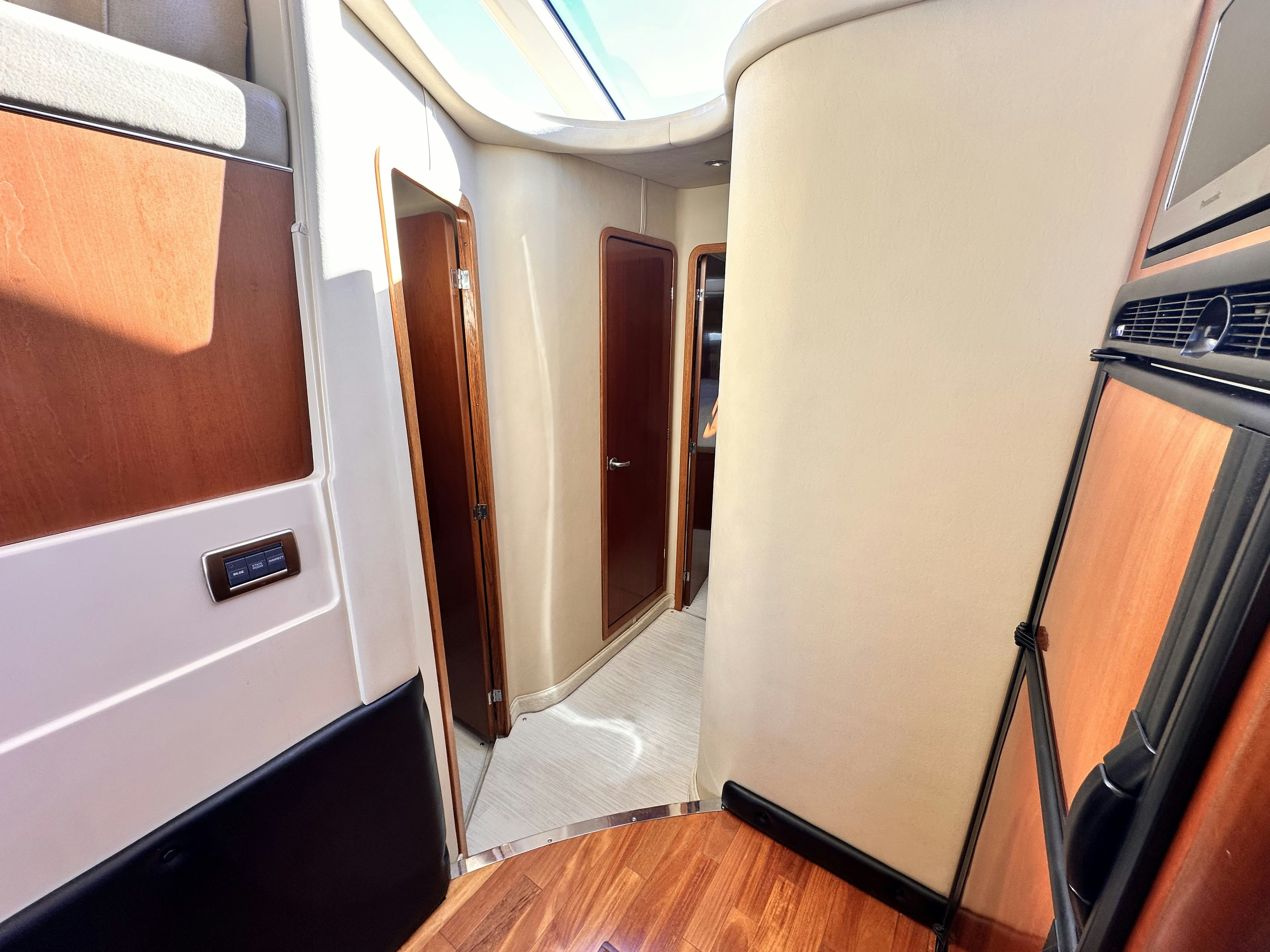 a room with a mirror and a door aboard LANAKILA Yacht for Sale