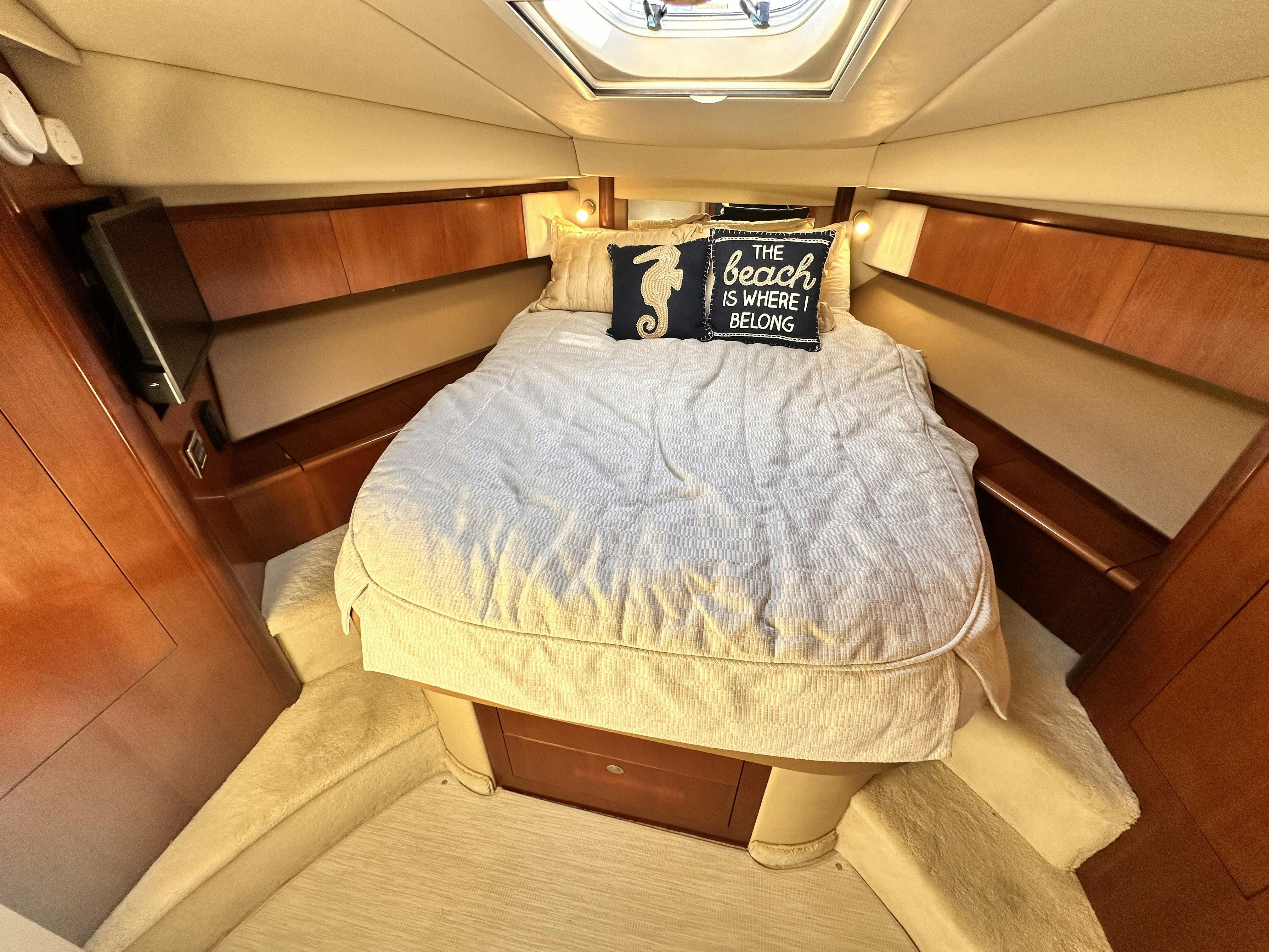 a bed in a room aboard LANAKILA Yacht for Sale