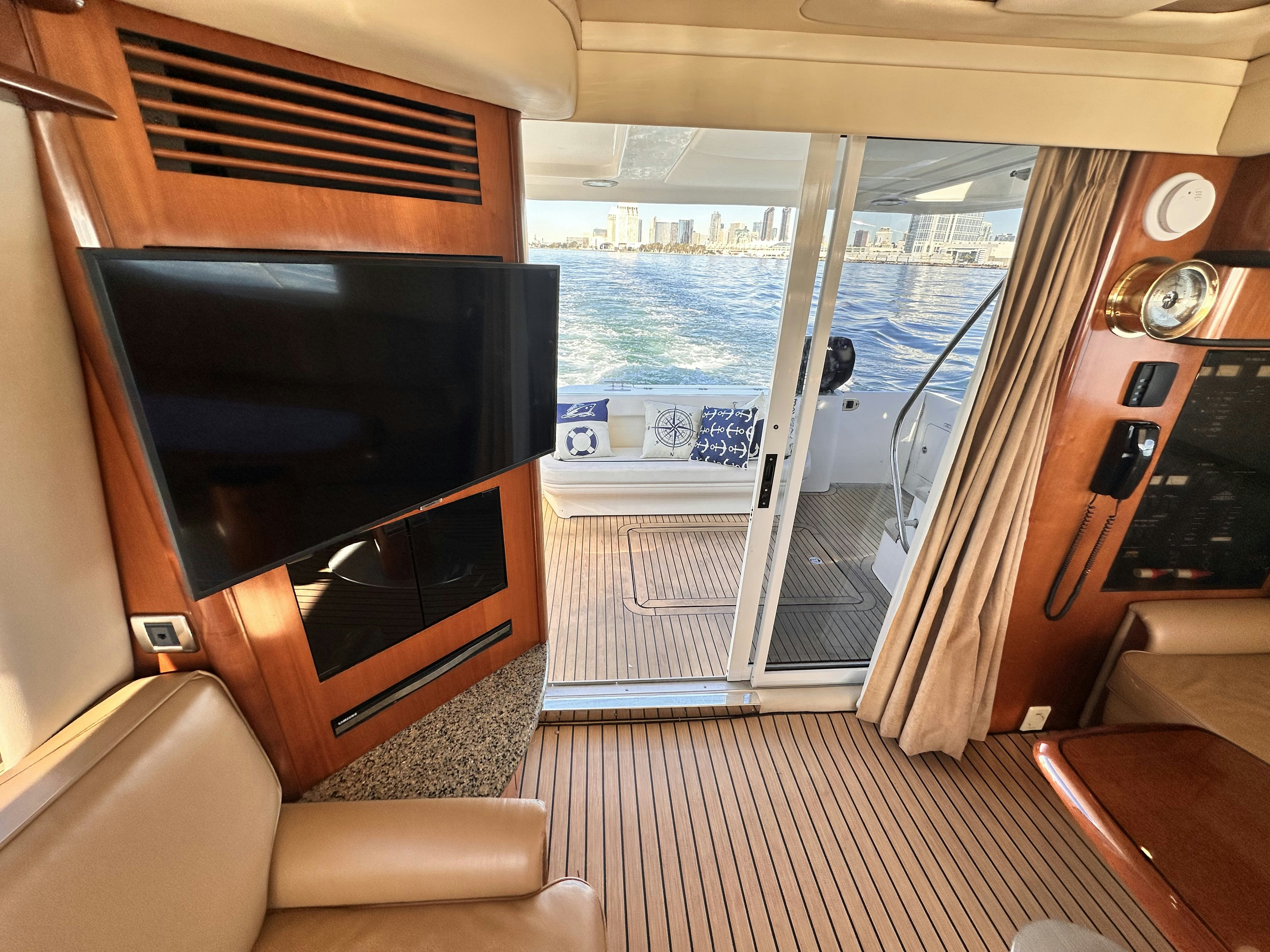 a living room with a fireplace aboard LANAKILA Yacht for Sale