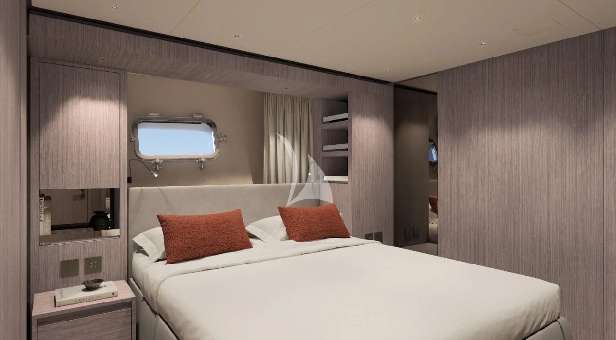 a bed with a white bed spread aboard CATCH ME Yacht for Charter