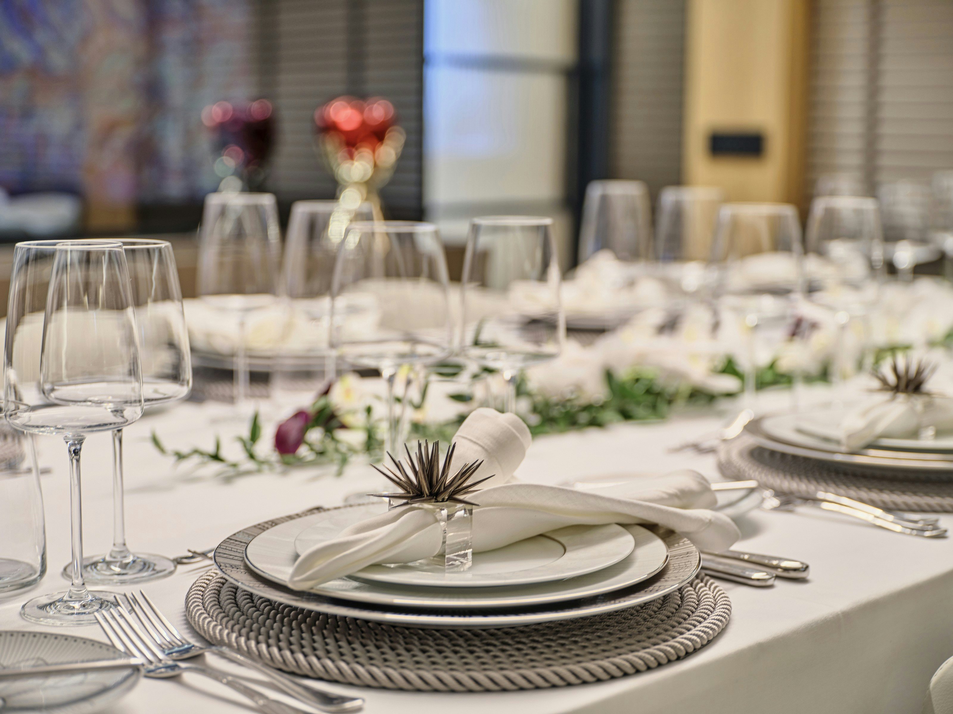 a table set with place settings aboard MAESTRO Yacht for Charter