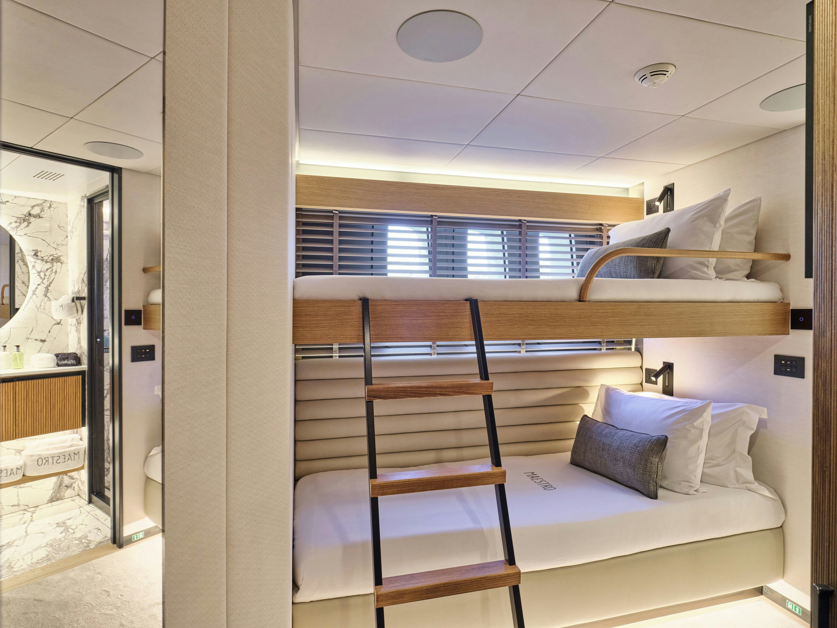 a bed in a room aboard MAESTRO Yacht for Charter