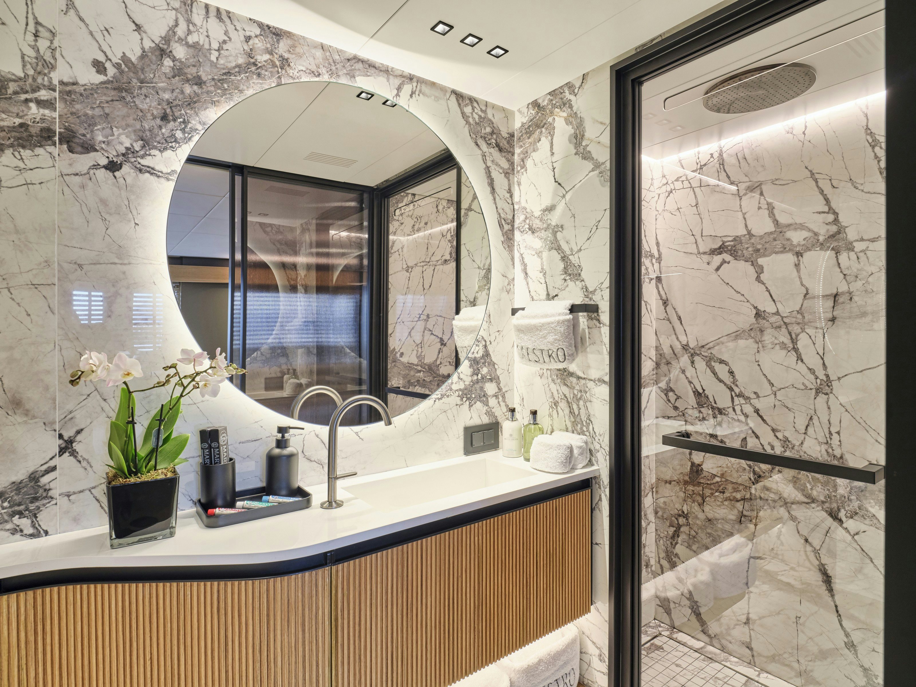 a bathroom with a large mirror aboard MAESTRO Yacht for Charter