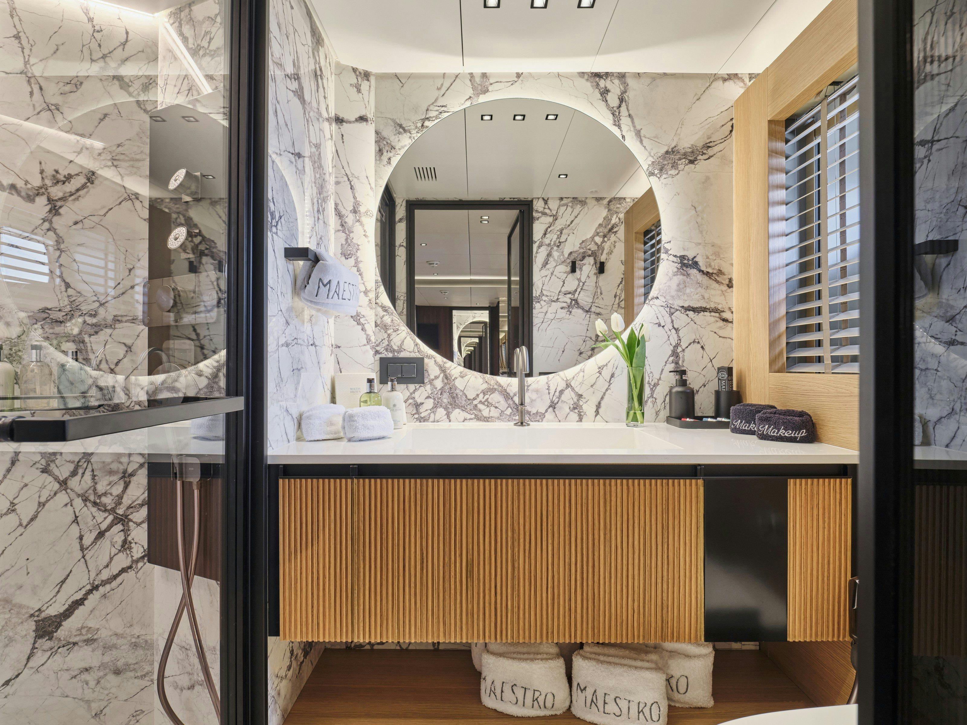 a bathroom with a large mirror aboard MAESTRO Yacht for Charter