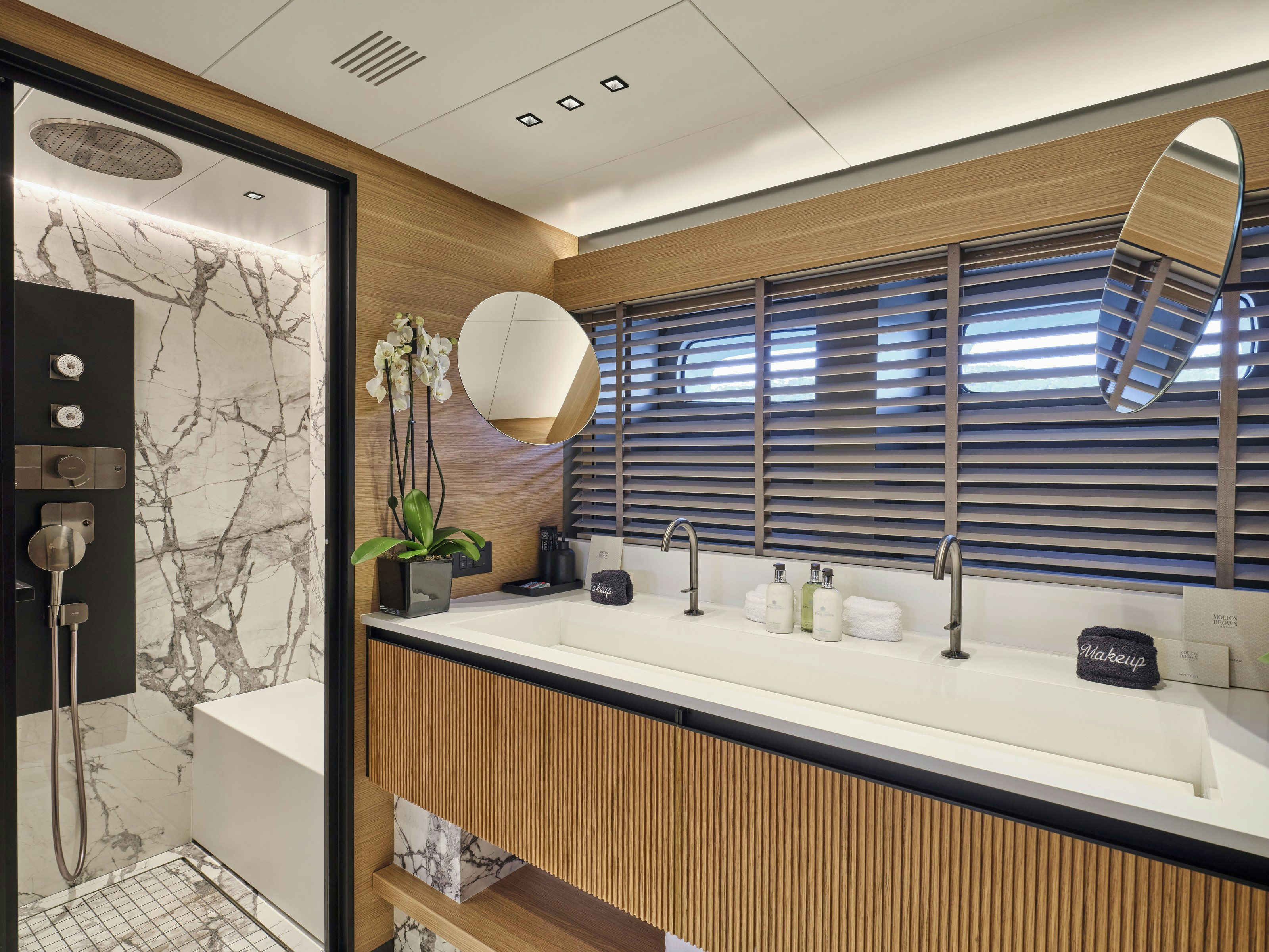 a bathroom with a large mirror aboard MAESTRO Yacht for Charter